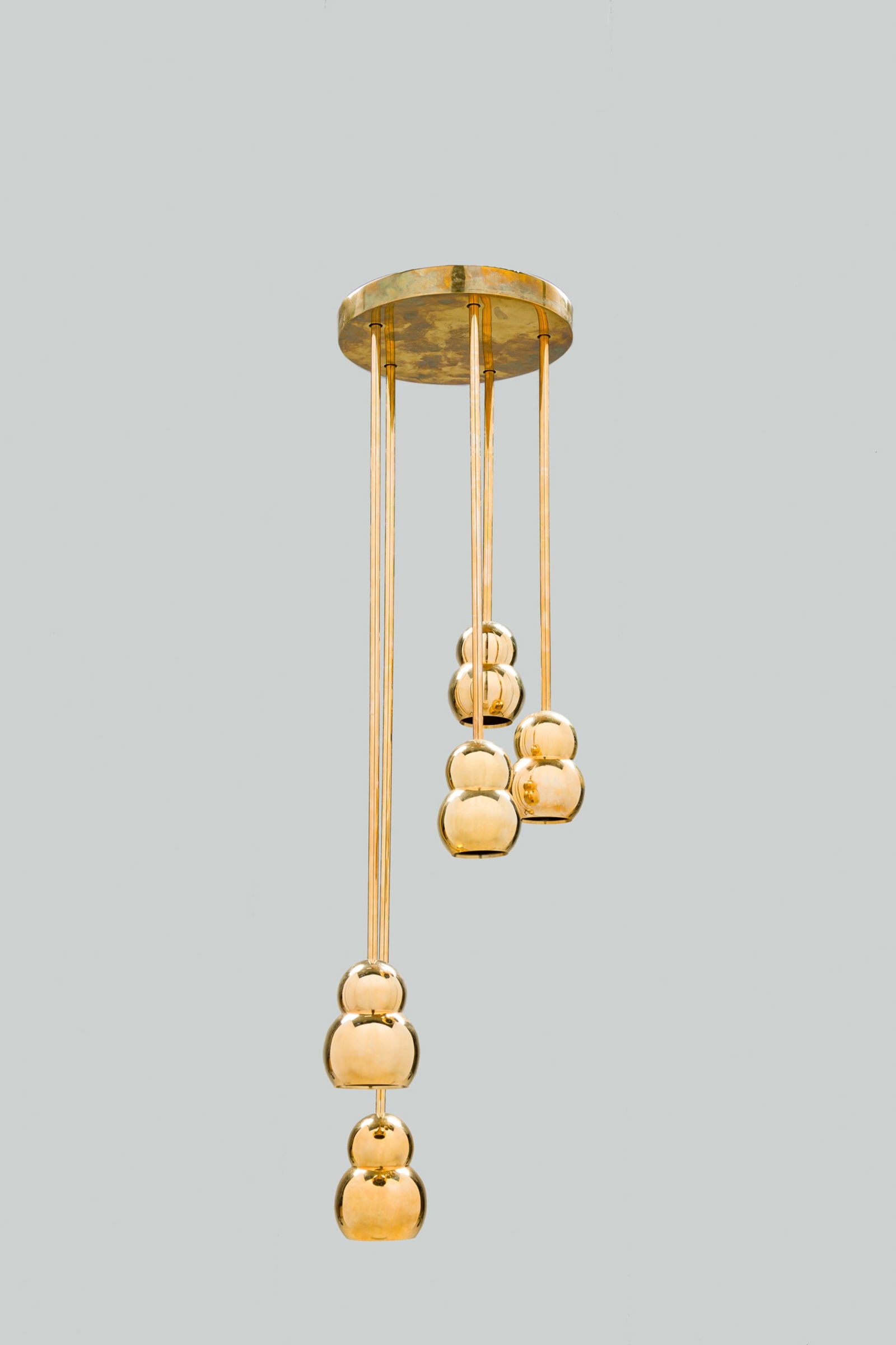 Michael Anastassiades Studio, 5-Light Chandelier: 21st c., USA, polished brass, five stem "Ball Light Pendant Rod" chandelier of various lengths, 29"h (to canopy)Provenance:A Private Collection: 36 Gramercy Park E