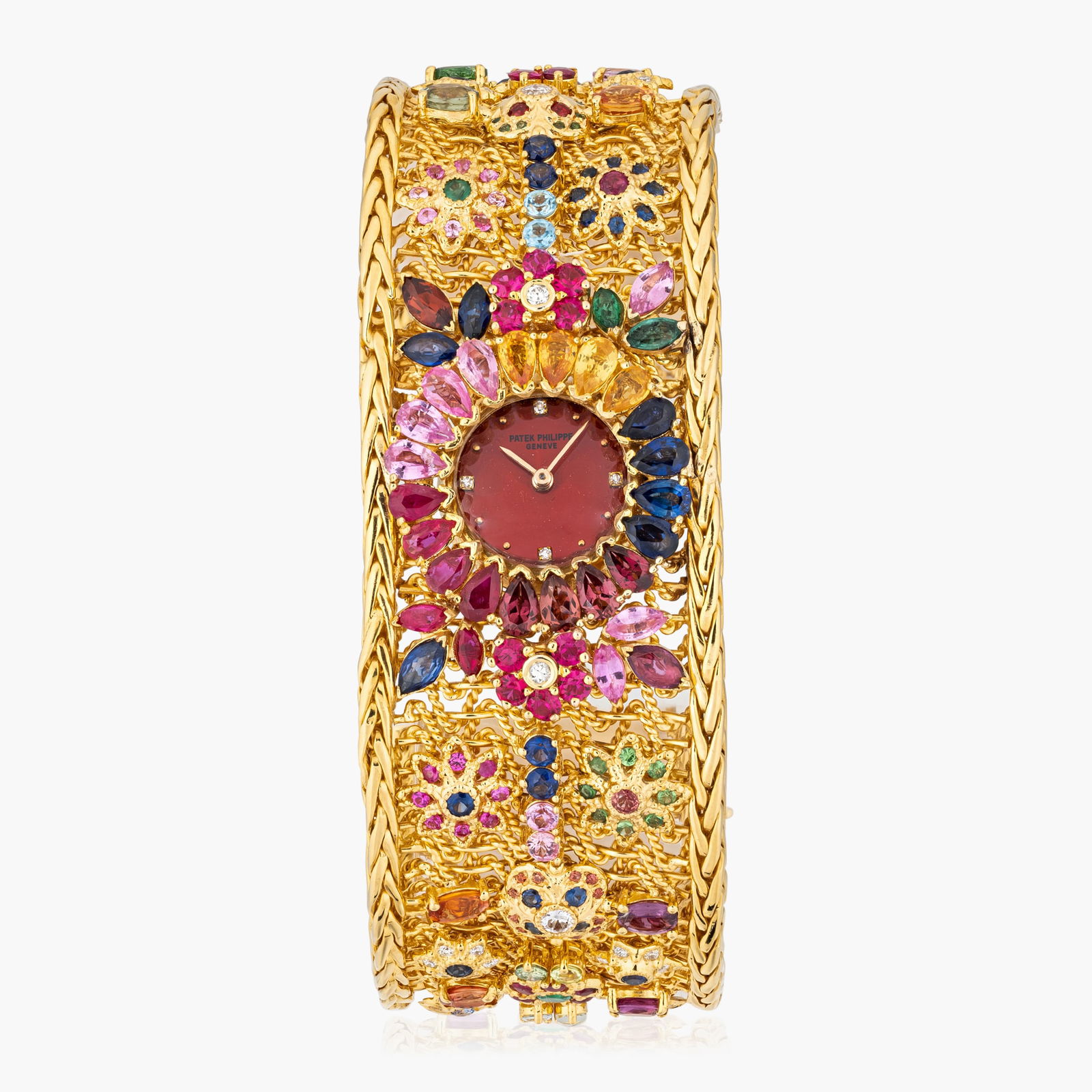 Patek Philippe Ladies Watch In 18K Gold With Colored Stones: Circa: 1960s Dial: Red enamel dial with applied hour markers Case material: 18K yellow gold Bracelet material:18K yellow gold mesh bracelet with colored stones Bracelet size: 6 1/2 inches Case dimensi