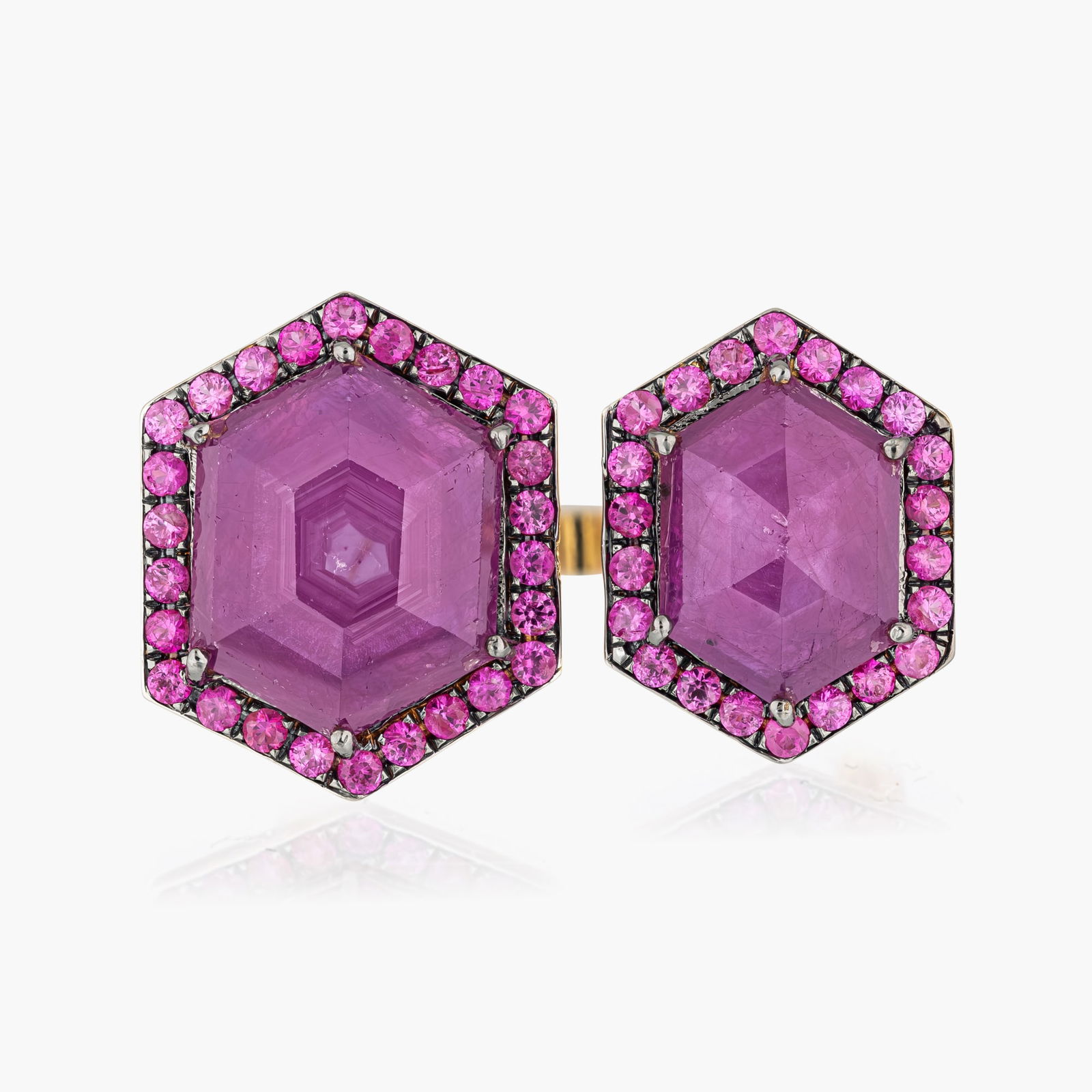 Hexagon Cut Unheated Ruby And Diamond Crossover Ring,GIA: Origin: Contemporary Metal: 18K yellow gold Gemstone(s)Ruby approx.9.73 carats total unheated GIA # 2233482930; sapphires approx.0.90 carats total Measurements: 1 1/4 inch wide Ring Size: 7 Weight: 6.