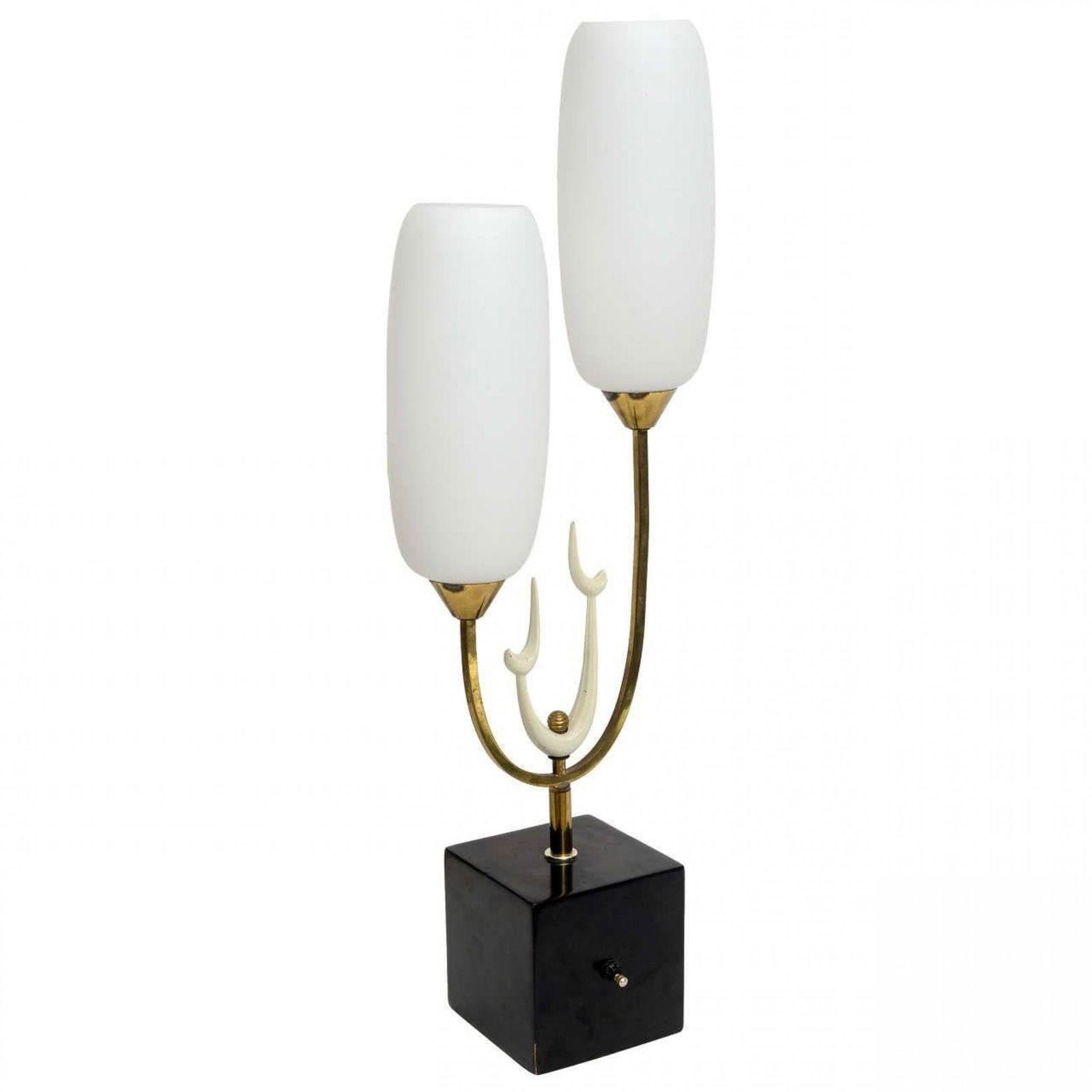 Arteluce Style, Italian Modern Brass Enamel and Glass Table Lamp: c. 1960s, Italy, capsule form milk glass shades, on brass and white enamel biomorphic base mounted to black metal cube pedestal, 33"h x 11"w x 6"d Shipping Note: LOCAL PICKUP IS NOT AN OPTION. All ite