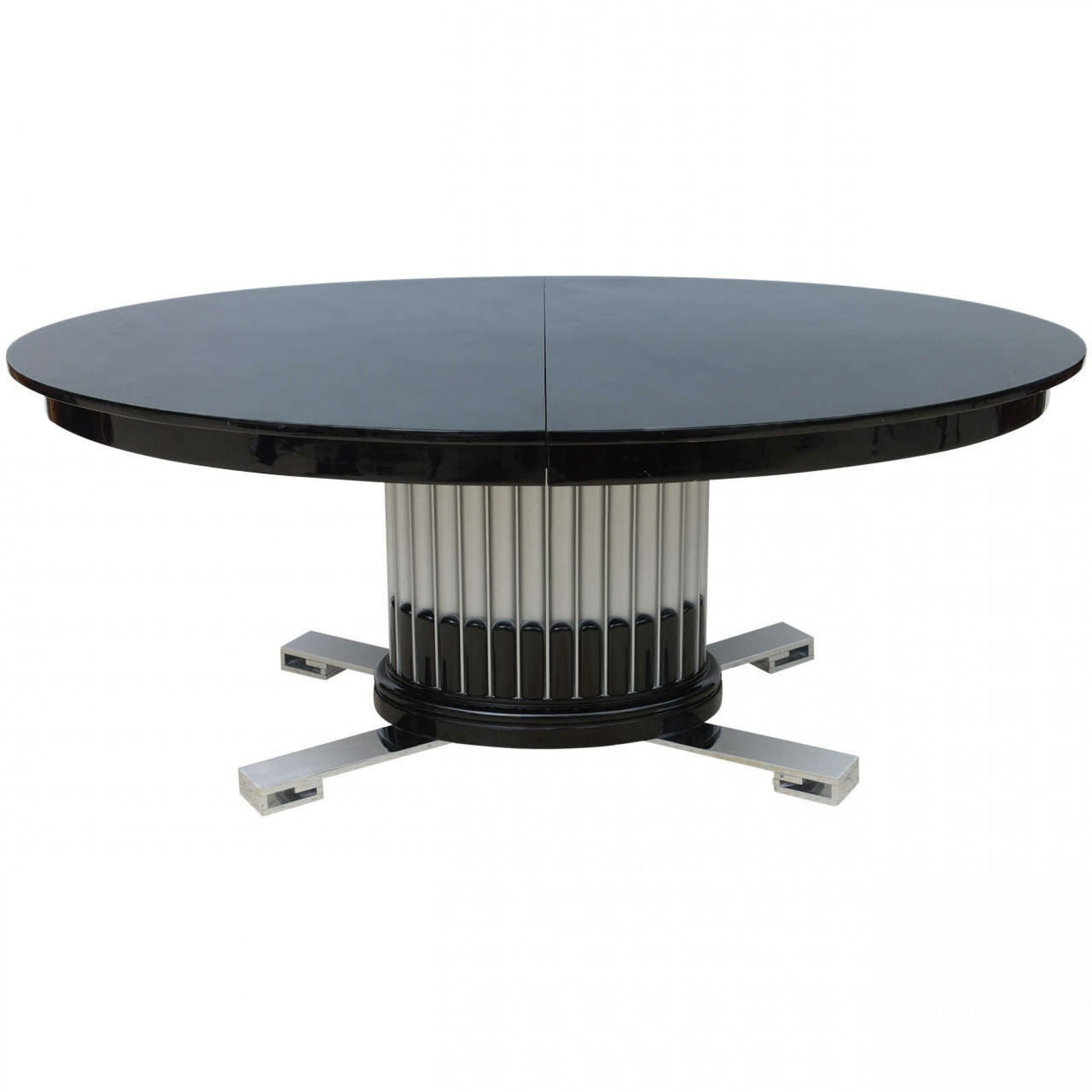 Deco Style Black Lacquered, Chrome and Silver Leaf Extension Dining Table : c. 1940s, USA, the oval black lacquered top over silver leaf fluted pedestal and chrome legs, lacking leaves, often attributed to Paul Frankl, 29"h x 71"l x 47"w Shipping Note: LOCAL PICKUP IS NOT AN