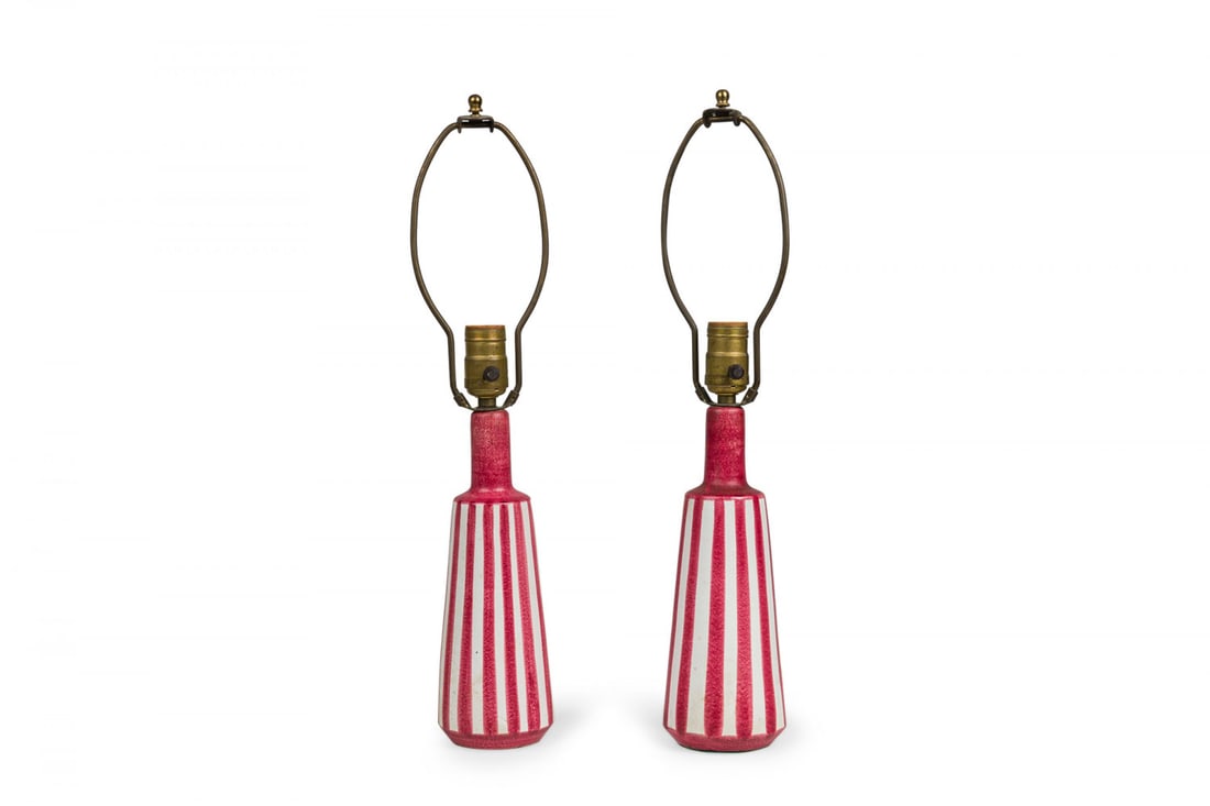 Pair of Mid-Century Italian Ceramic Hand Painted Candy Stripe Table Lamps: c. mid-20th c., Italy, ceramic foot, brass light switch sockets, finials and harps, glazed ceramic body with hand painted red and white pattern, 13.25"h x 4"dia Shipping Note: LOCAL PICKUP IS NOT AN O
