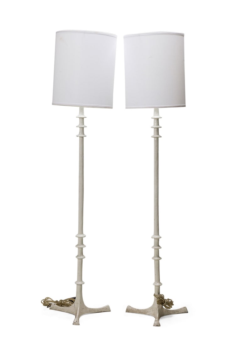 Diego Giacometti Style, Pair Painted Cast Metal Floor Lamps : 20th c., white painted modern Classical design, white cloth drum shades, 67"h x 14.25"dia Shipping Note: LOCAL PICKUP IS NOT AN OPTION. All items MUST be shipped via LiveAuctioneers Shipping Services.