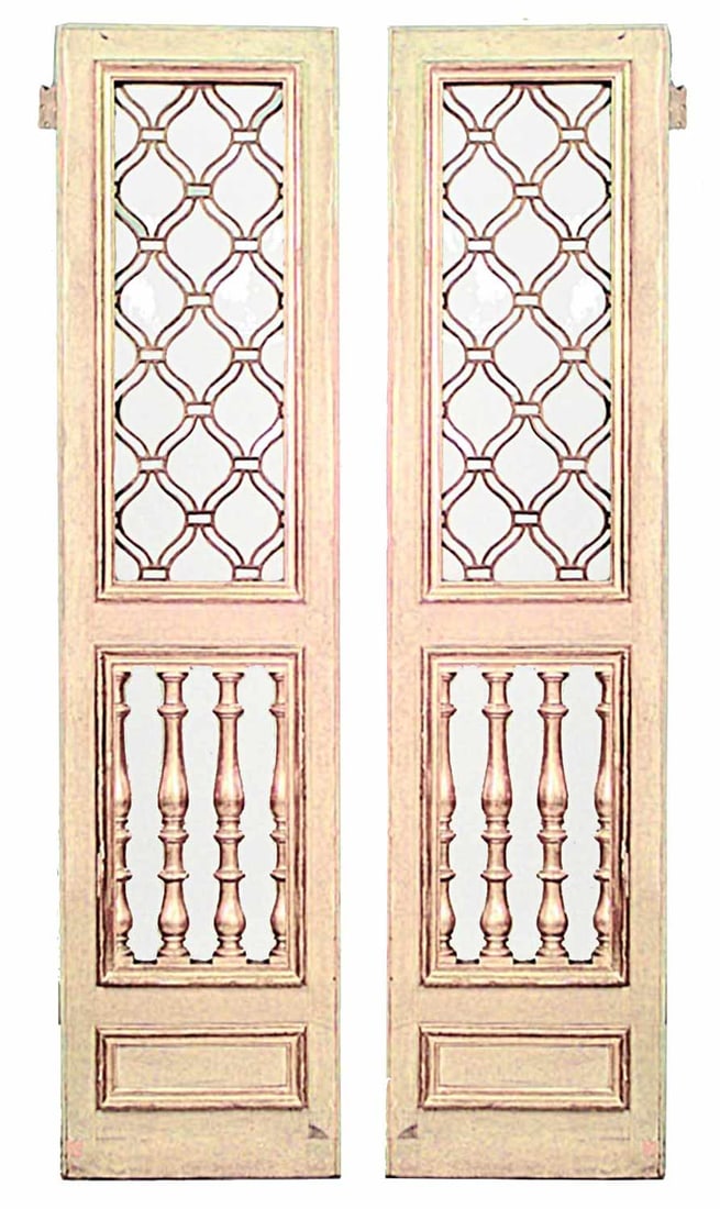 Pair Italian Neoclassical style painted wood and glass doors: 20th c., parcel gilt & cream painted doors with leaded glass inset panels above lower balustrade grilled panels, 92" h x 45.5"w