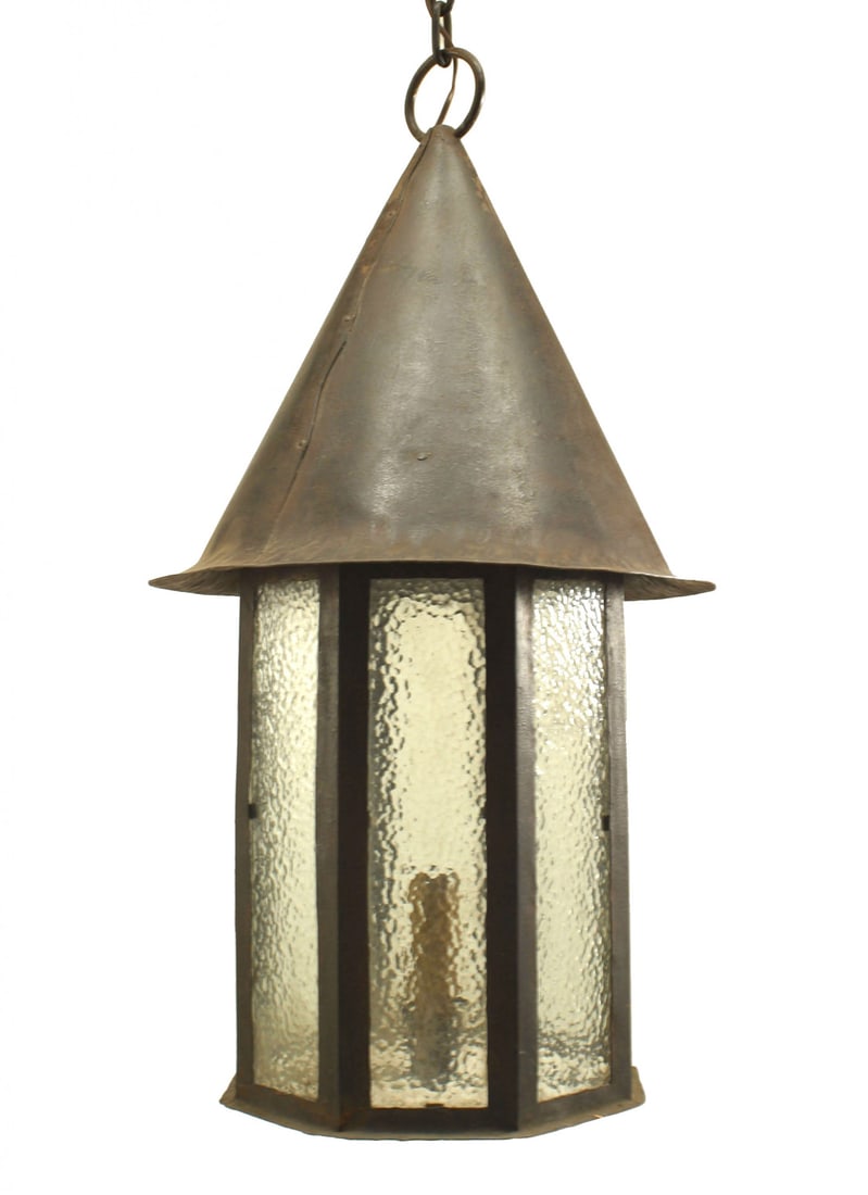 Pair Arts & Crafts style iron and glass lanterns: early 20th c., USA, 8 textured glass panels framed in black painted iron, with a cone shaped top, electrified with single socket, 30"h x 16"dia