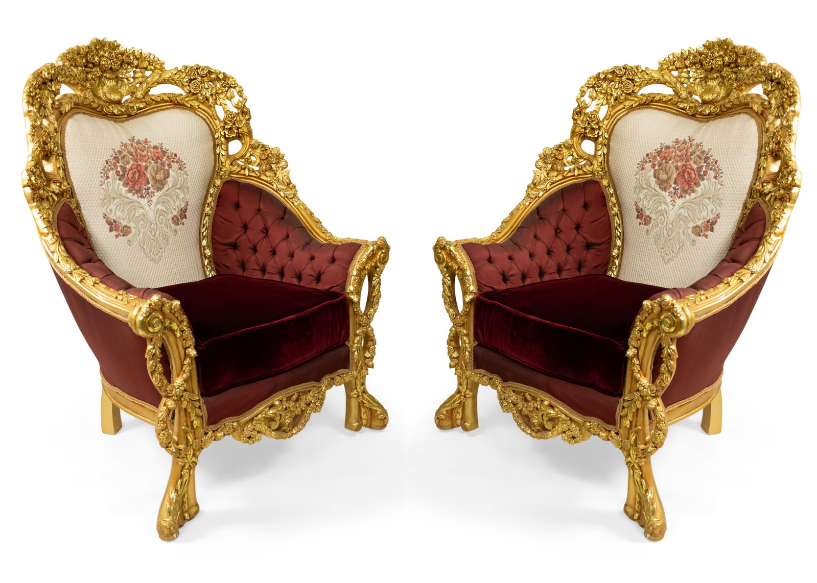 Pair of Italian Baroque style giltwood armchairs: 20th c., giltwood frame carved with rose heads and floral swags, the padded back upholstered in floral needlepoint tapestry fabric, the seat and sides in button-tufted maroon velvet, 53" h x 40"w x 30