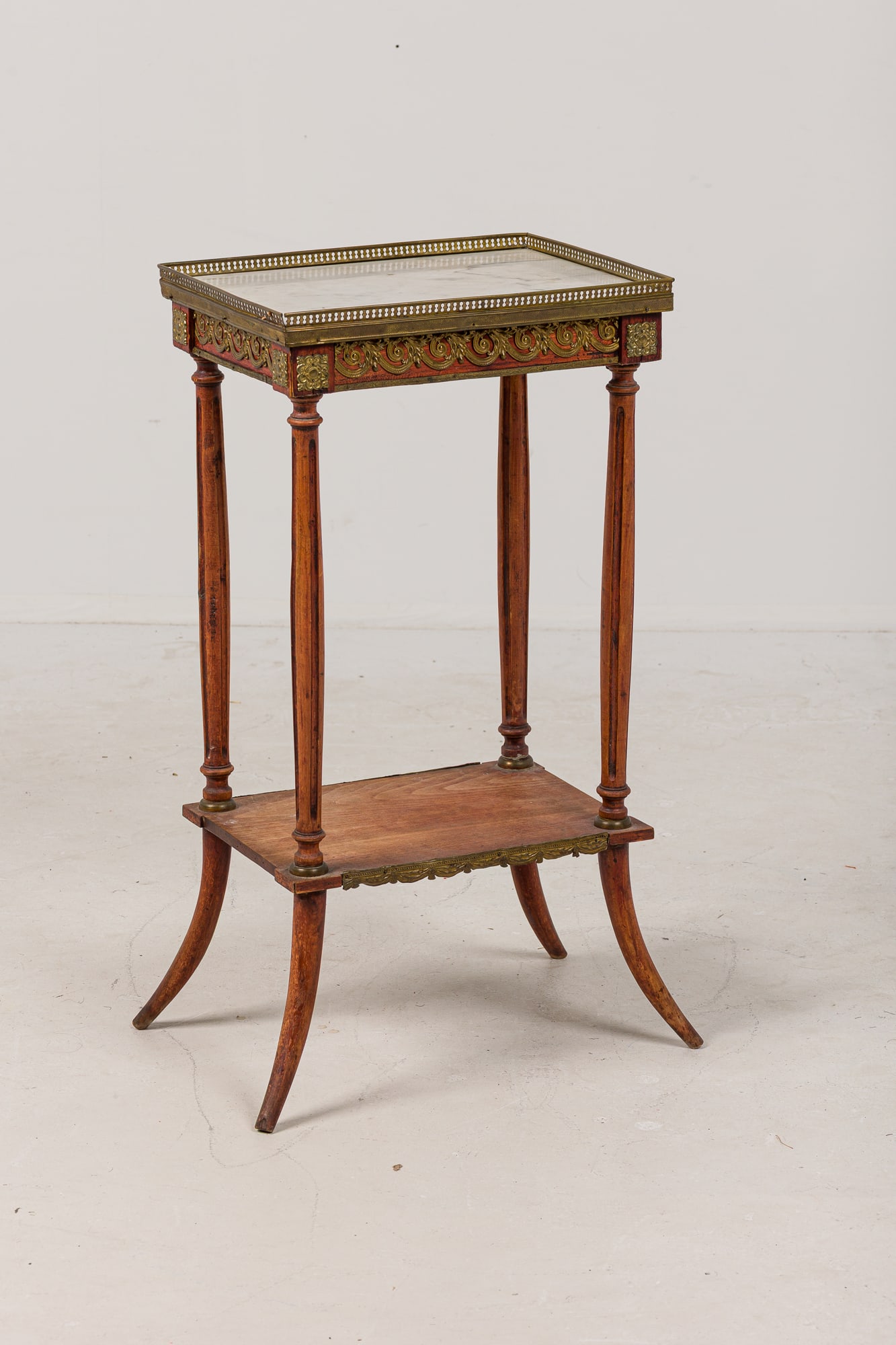 King Louis XVI style two tier jardiniere with marble top: 19th c., France, rectangular mahogany two tier frame, inset white marble top with a bronze pierced gallery and gilt metal mounts, resting on four turned tapering legs united by lower tier, 31"h x 16"l