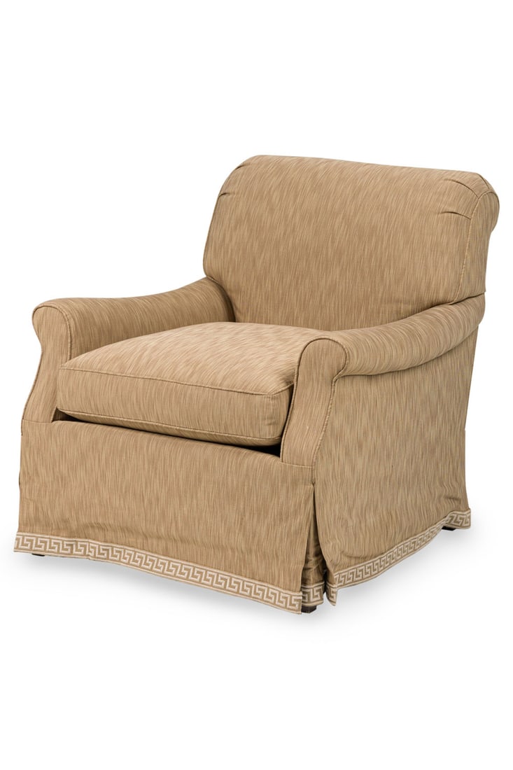 Modern Beige Round Back Armchair: 20 / 21st c., USA, square back with rolled arms, loose seat cushion, upholstered in a tan fire stitch patterned fabric, skirted base with a beige greek key trim, 34"h x 33"w x 36"d, 19"h (to seat)