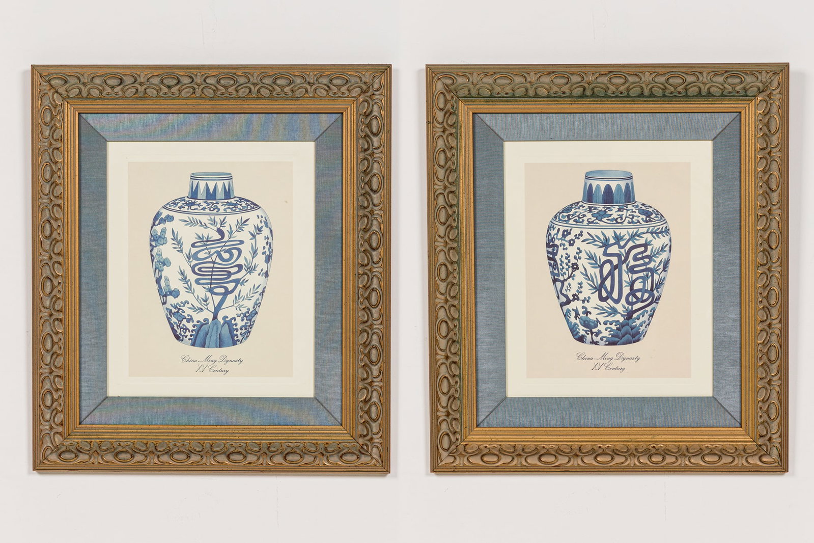 Pair lithographs of Chinese ginger jars: 20th c., featuring Ming porcelain vases printed on art paper, gilt wooden frames, under plexiglass 16"h x 12.5"w (sheet), 25.25"h x 10"w (frame) Provenance: 465 Park Ave