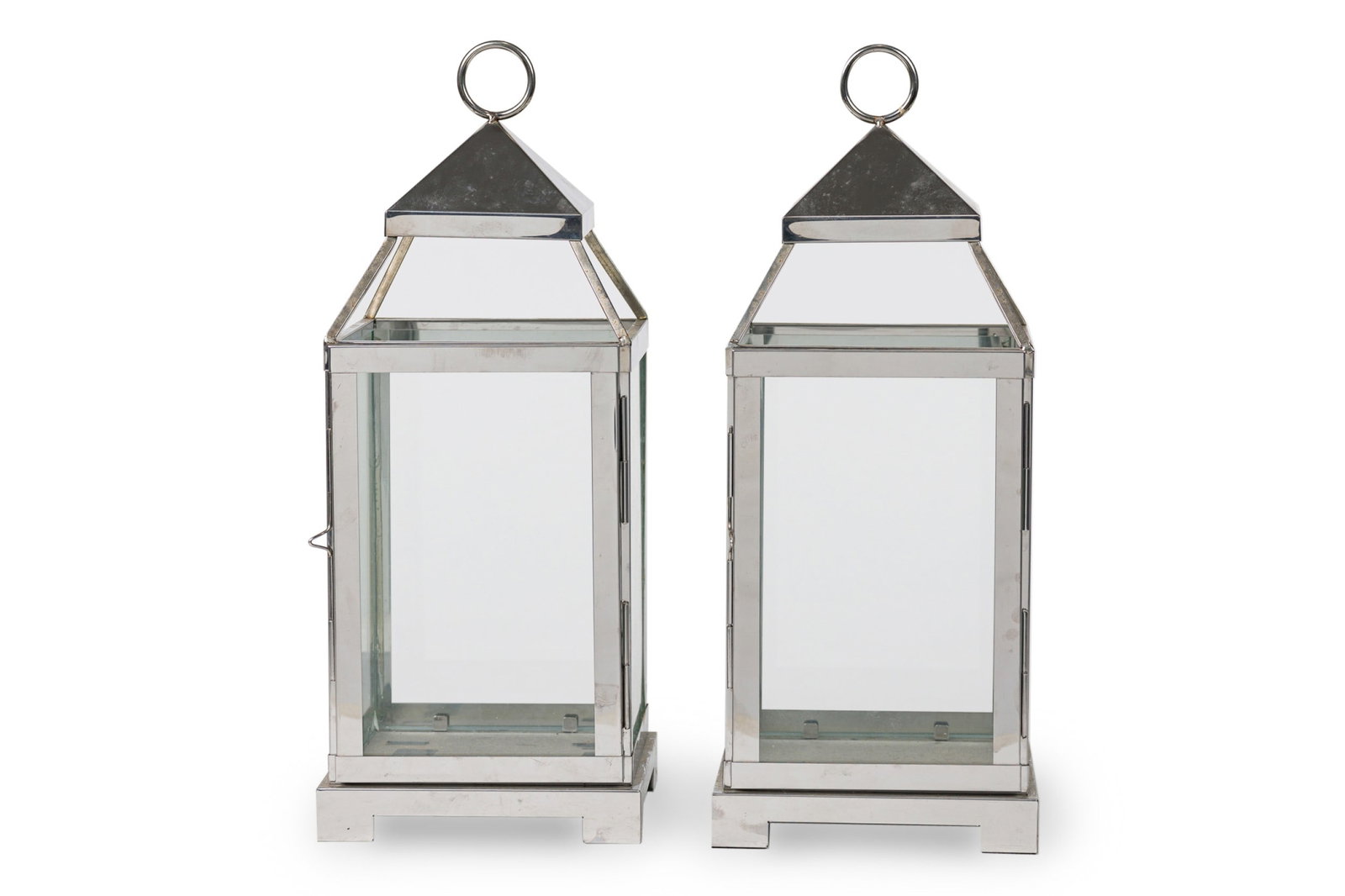 Pottery Barn, Pair Chrome and Glass Lanterns: 20th/21st c., USA, with a circular handle for hanging and carrying,18.5" h x 7"w x 7"d