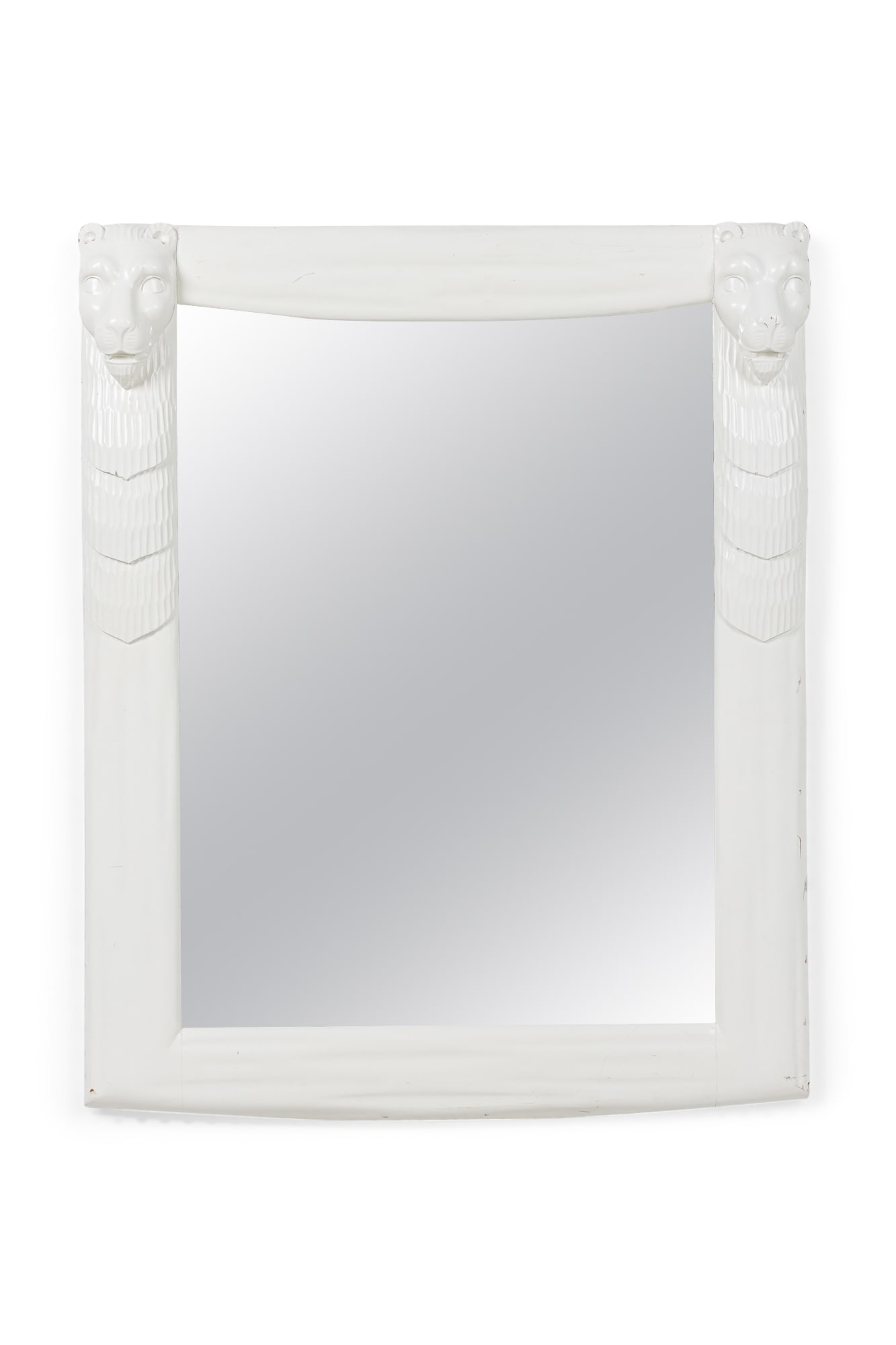John Dickinson (manner), carved and painted mirror: c. 1970s, USA, white lacquered wood, mirror glass, the frame carved with stylized lion masks on the upper corners , 39" h x 31.5"w x 4"d