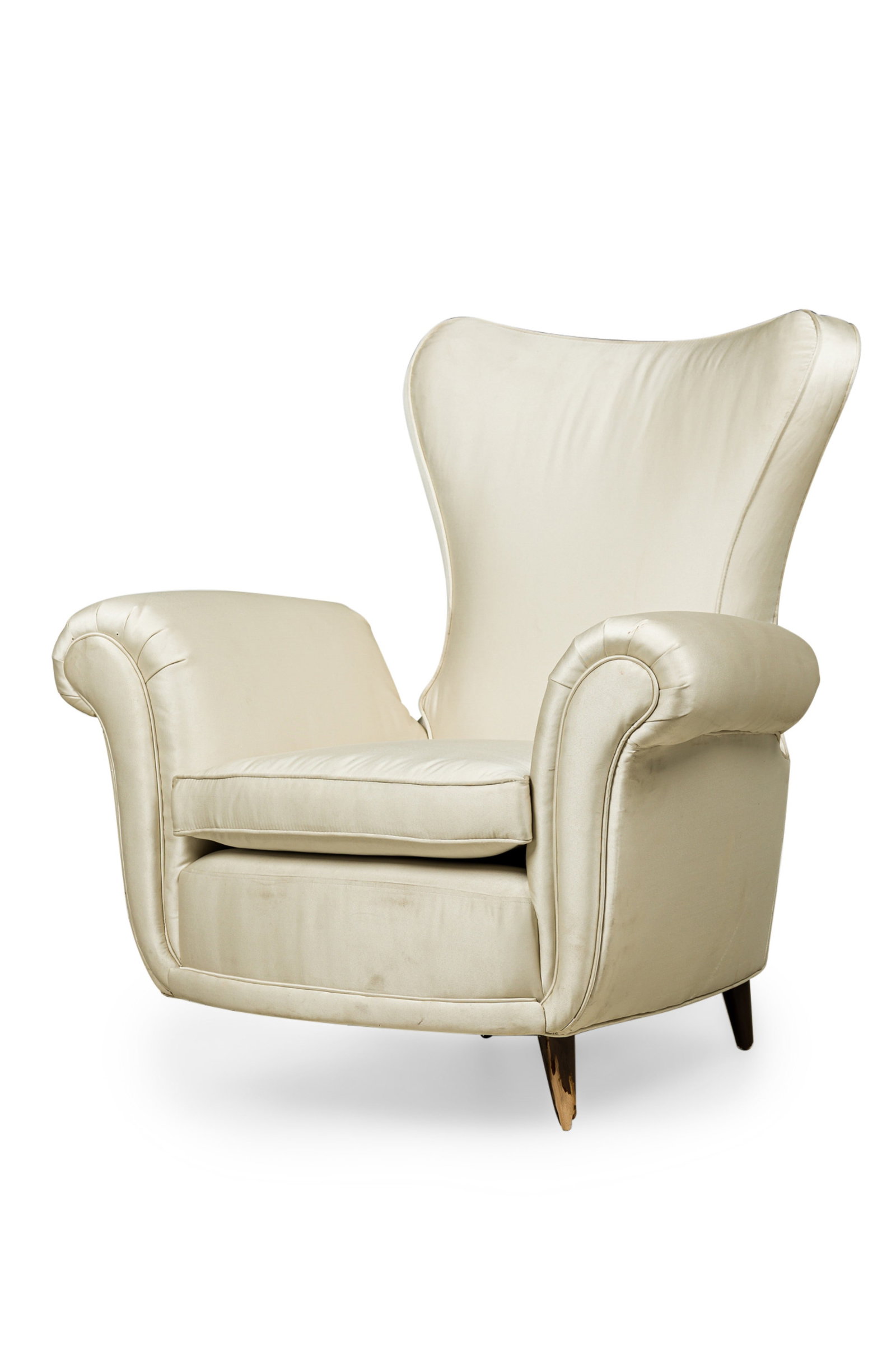 Italian Modern satin upholstered lounge chair: mid-20th c., Italy, featuring a flared backrest with rounded corners and scroll armrests, upholstered in an off-white satin fabric, damage to legs, 36" h x 34.5"w x 32"d, 16"h (to seat)