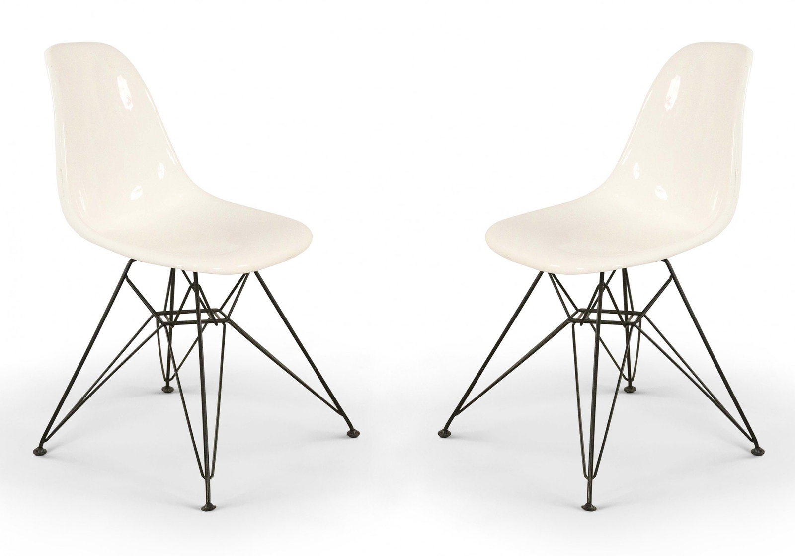 Eames for Herman Miller (Style), molded plastic shell chairs: 21st c., USA, black molded plastic shell on a metal Eiffel tower bases, 32.5"h x 18"w x 21"d