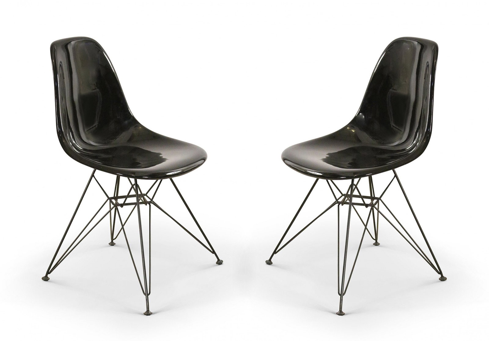 Eames for Herman Miller (Style), pair molded plastic shell chairs: 21st c., USA, black molded plastic shell on a metal Eiffel tower bases, 32.5"h x 18"w x 21"d