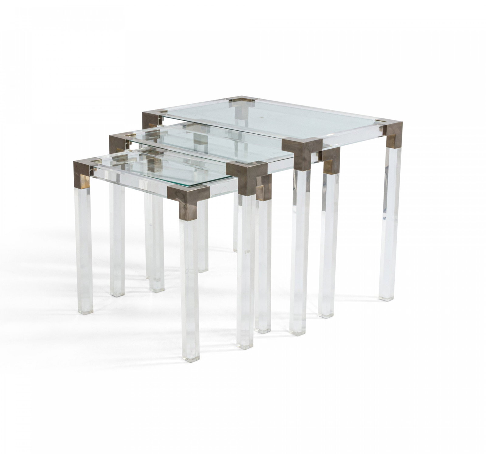 Maison Jansen (Manner of), set of (3) lucite & metal nesting tables: c. 1970s, France, rectangular lucite frames with inset tops, metal hardware on the corners, 19.5"h x 23"w x 15.5"d (largest)