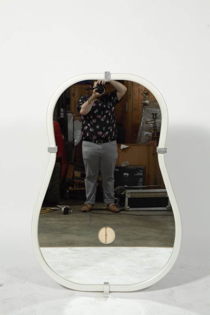 Donghia (Style), 4 anjou wall mirrors: 20/21st c., USA, pear shaped wall mirrors set in white painted frame with four silver leaf metal clips, with provision for adding a wall sconce, 53"h x 36"w x 2"dProvenance: Property from the Collecti