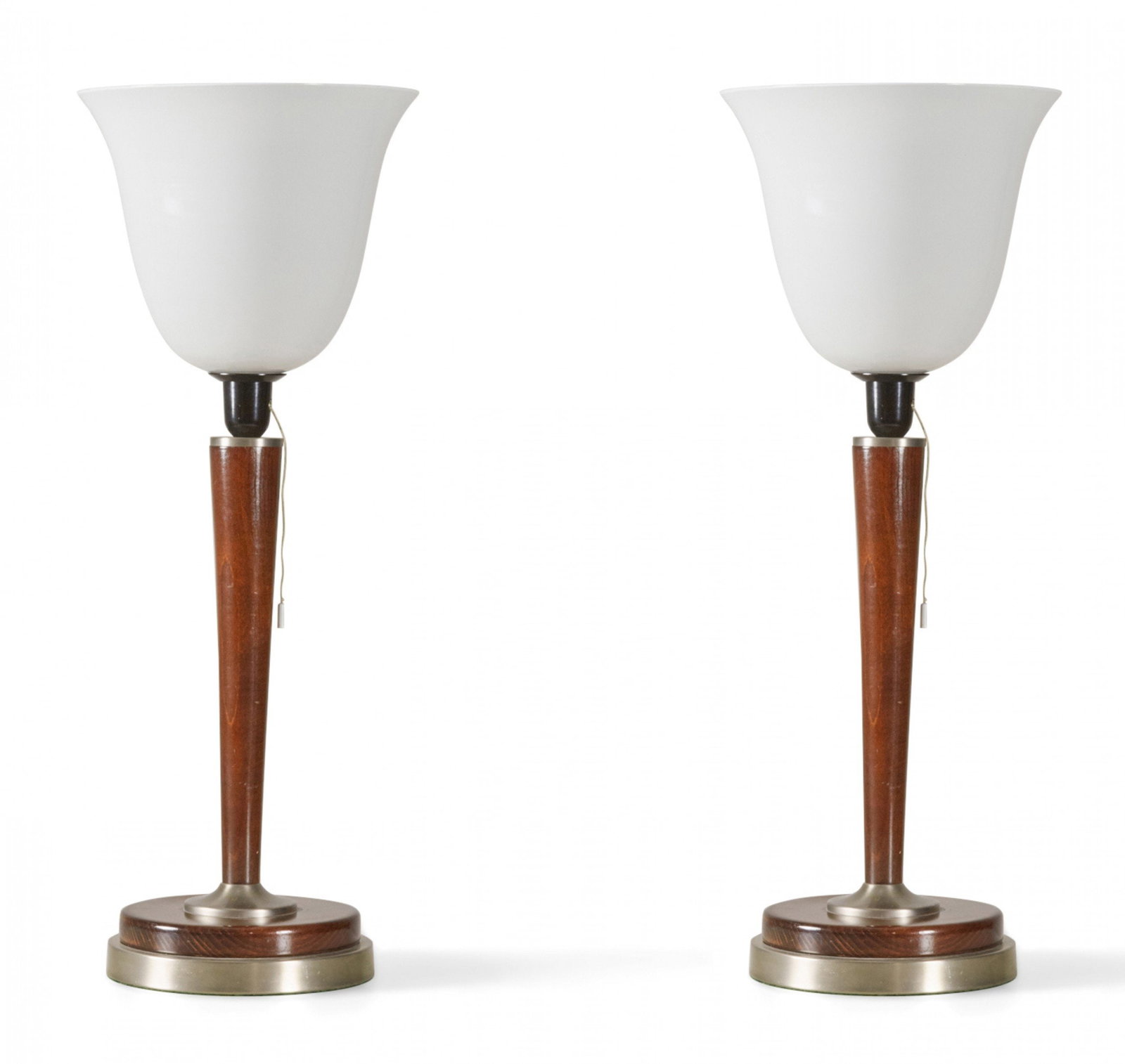 Pair of Art Deco metal and wood uplighter table lamps: c. 1940s, USA, single socket fixture with pull chain, topped with large bell-shaped white glass shades, resting on wood and brushed metal bases, 27"h x 10"dia