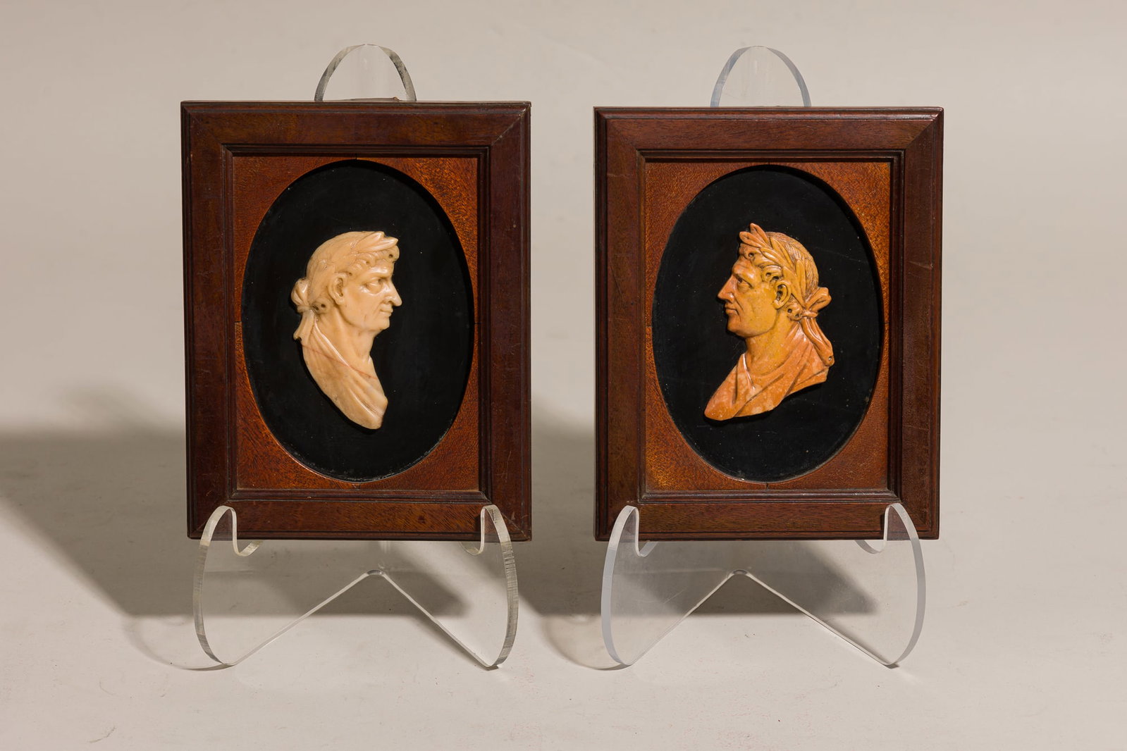 Pair Grand Tour marble Caesar portrait medallions: 19th c., Italy, white and amber marble, mounted to black lacquered base, in mahogany frame, 7"h x 5.5"w (frame) Provenance: Property from 502 Park Ave: A Stephen Bastone bespoke 