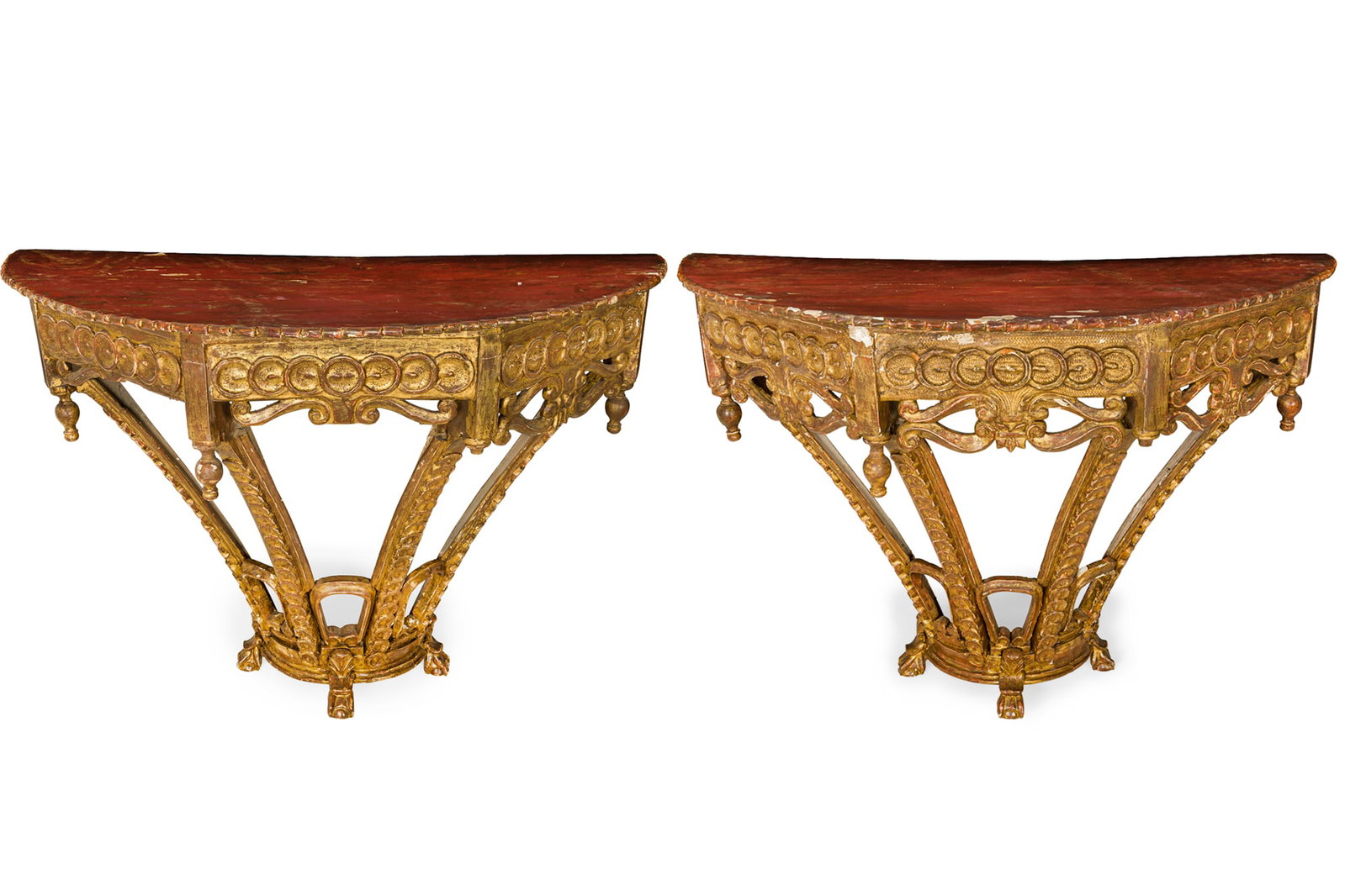 Pair Venetian Louis XVI style giltwood wall consoles: 18th c., Italy, red and brown faux-marble painted wooden top, over ornately carved giltwood frieze set with bobbin drops, raised on four legs tapering toward a bottom demilune stretcher