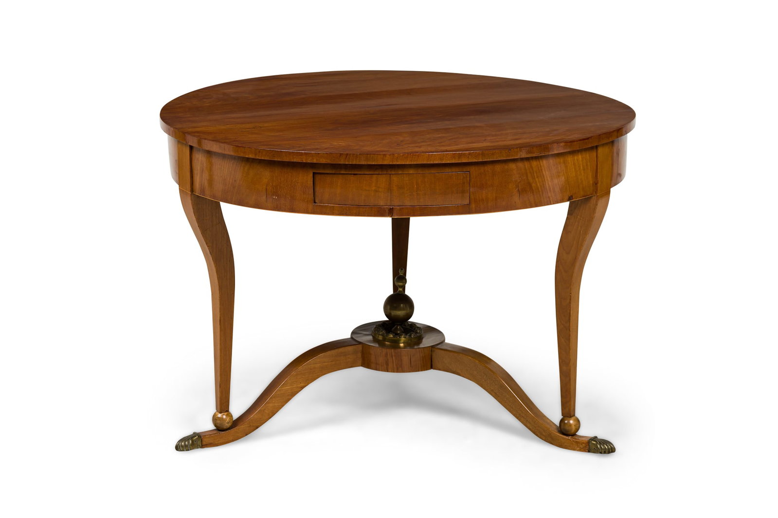 Austrian Biedermeier cherrywood center table: 19th c., Austria, round cherrywood top resting on three scroll legs connected by a tripartite base with a central brass finial, 29.5"h x 44"w x 44"d Category: Cente