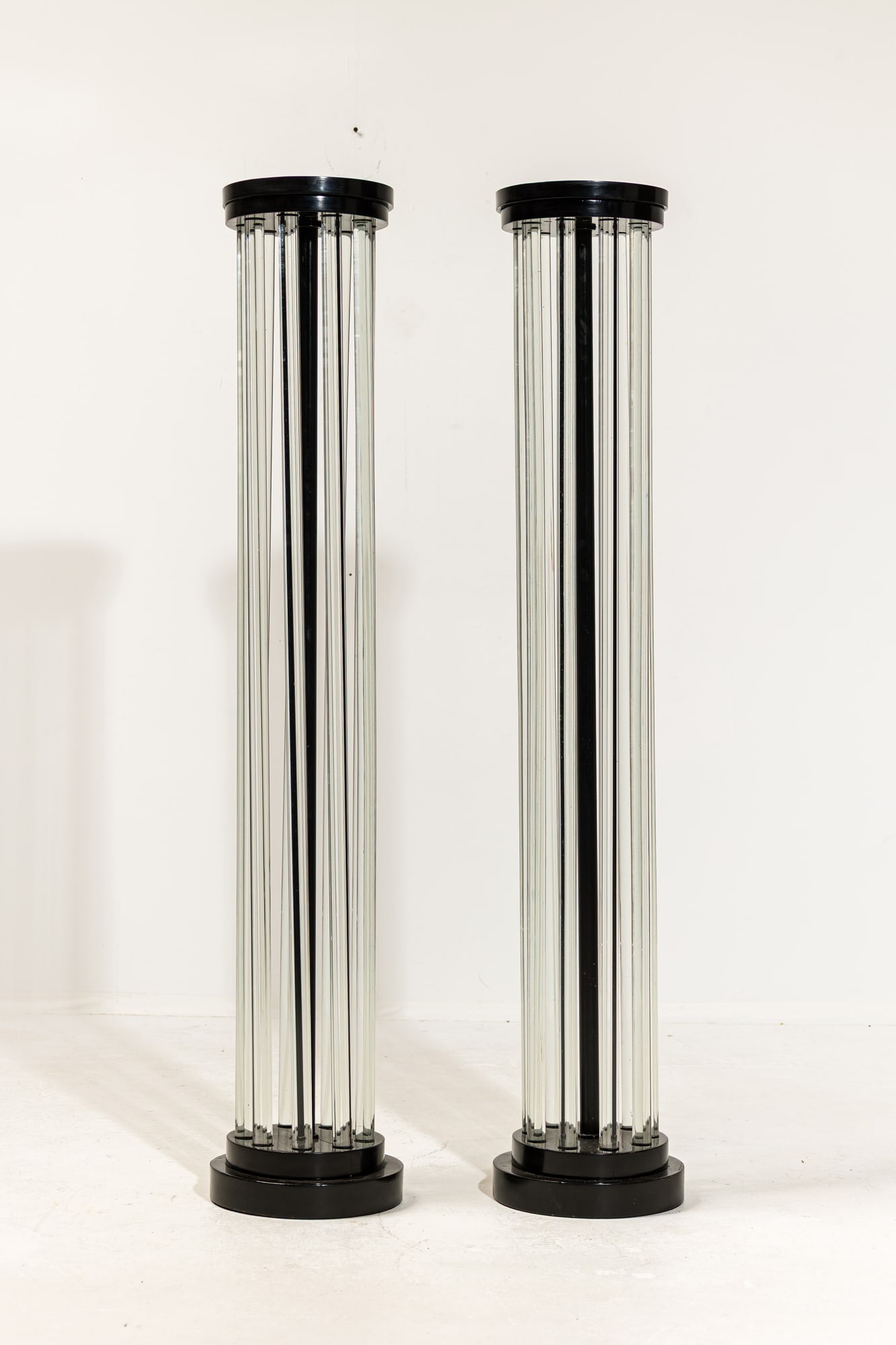 Robert Locher, Pair American Art Deco glass rod pedestals, ex-Sotheby's: Robert Evans Locher (USA, 1888-1956), c. 1925, the high gloss black piano lacquer top and based joined by clear glass dowels, likely custom designed for the Beatrice Howard Slack estate,&nbs