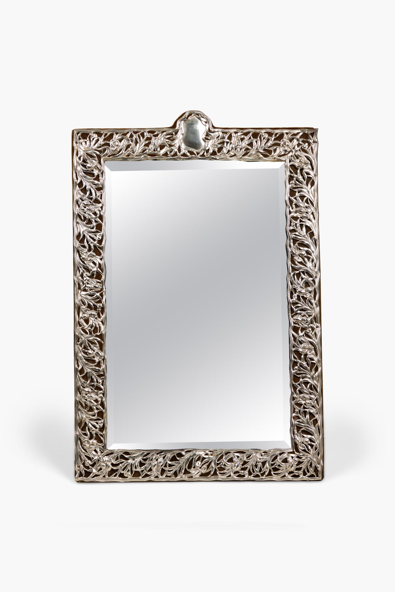Goldsmiths & Silversmiths Co, English Silver Art Nouveau table mirror: letter dated 1904, England, the sterling silver frame repousse decorated with openwork foliate scrolls, mounted to brown velvet covered wood base, fully hallmarked, 28"h x 18.75"w x 9.2