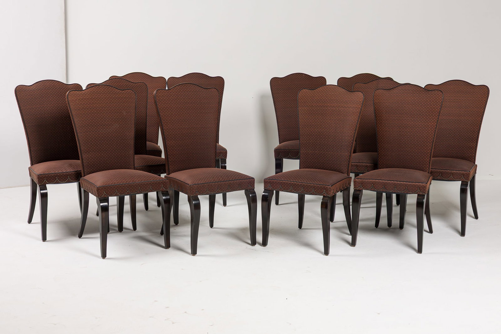 Stephen Bastone, (12) Art Deco style Hermes horsehair upholstered dining chairs: 21st c, high back with shaped top, the seat with swagged nailhead decoration around the sides, upholstered in Hermes, Paris chocolate brown woven horse hair, with black leather piping, raised on 