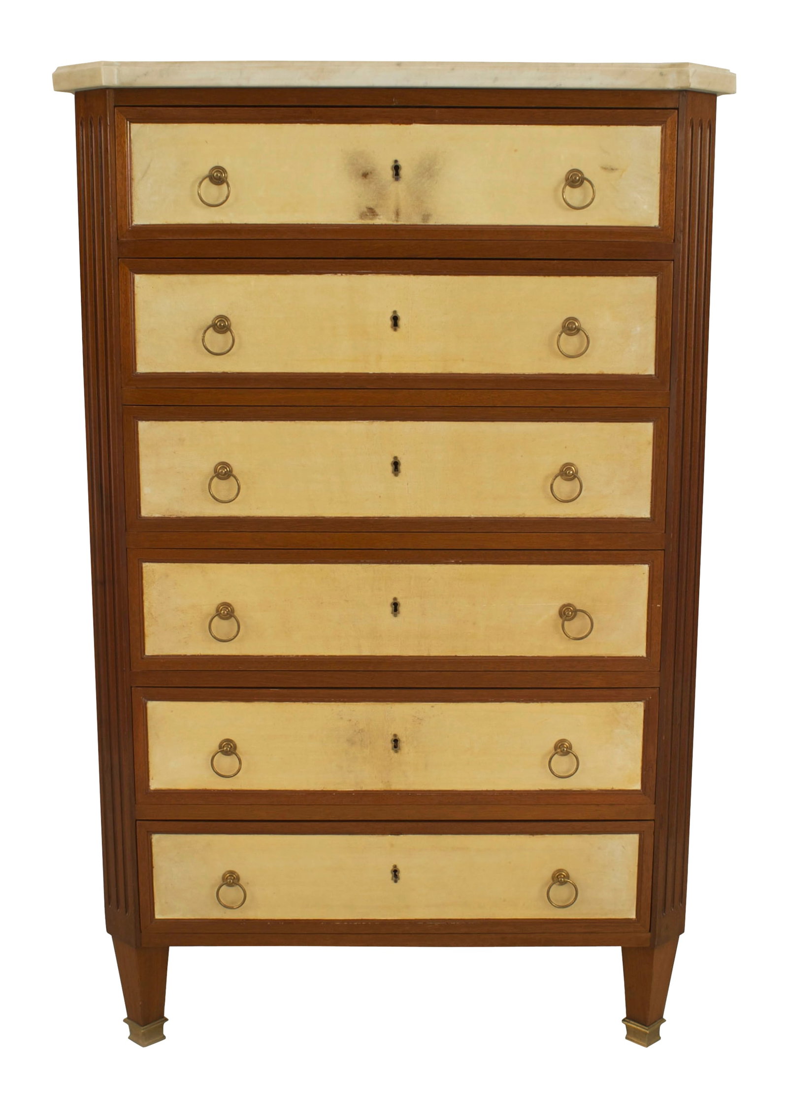Maison Jansen, Louis XVI style mahogany chiffonnier: c. 1940s, France, shaped Carrera marble top with canted corners over mahogany chest set with six parchment fronted drawers and bronze ring handles, stamped JANSEN, includes key for the top drawer