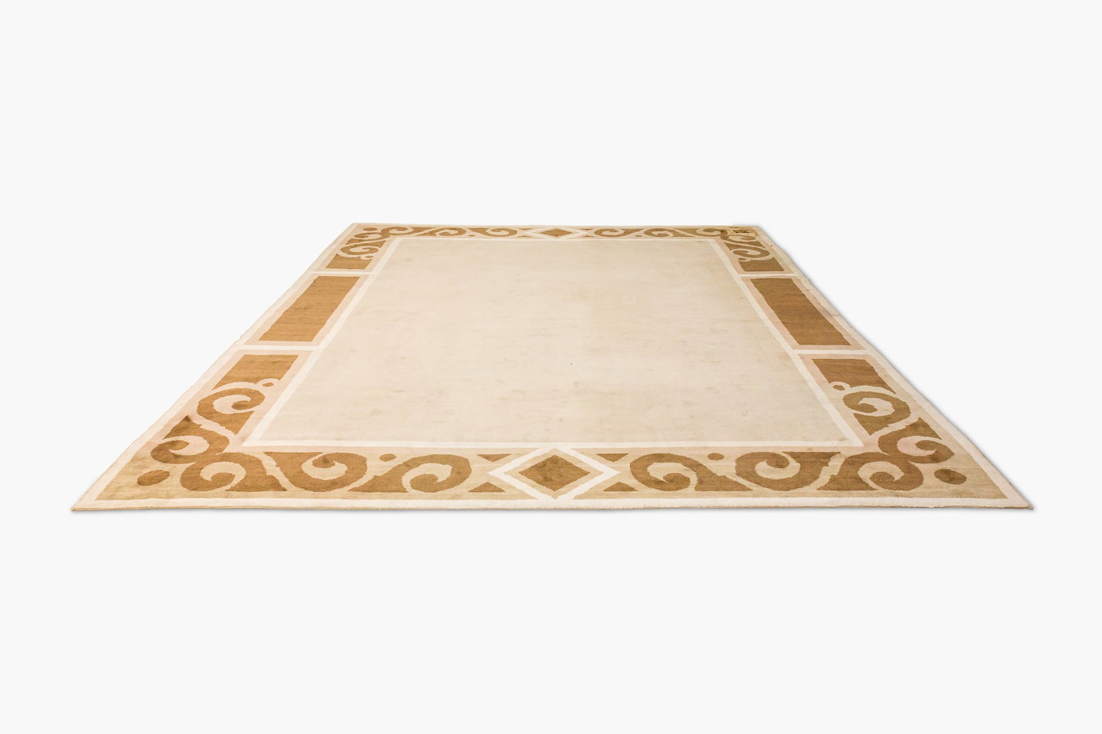 Andre Arbus (after), custom beige and brown geometric room size carpet: 21st c., brown beige and cream hand knotted wool with half inch pile, geometric scrolling border, oversized, after a design by Andre Arbus, commissioned from Beauvais Carpets by Stephen Bast