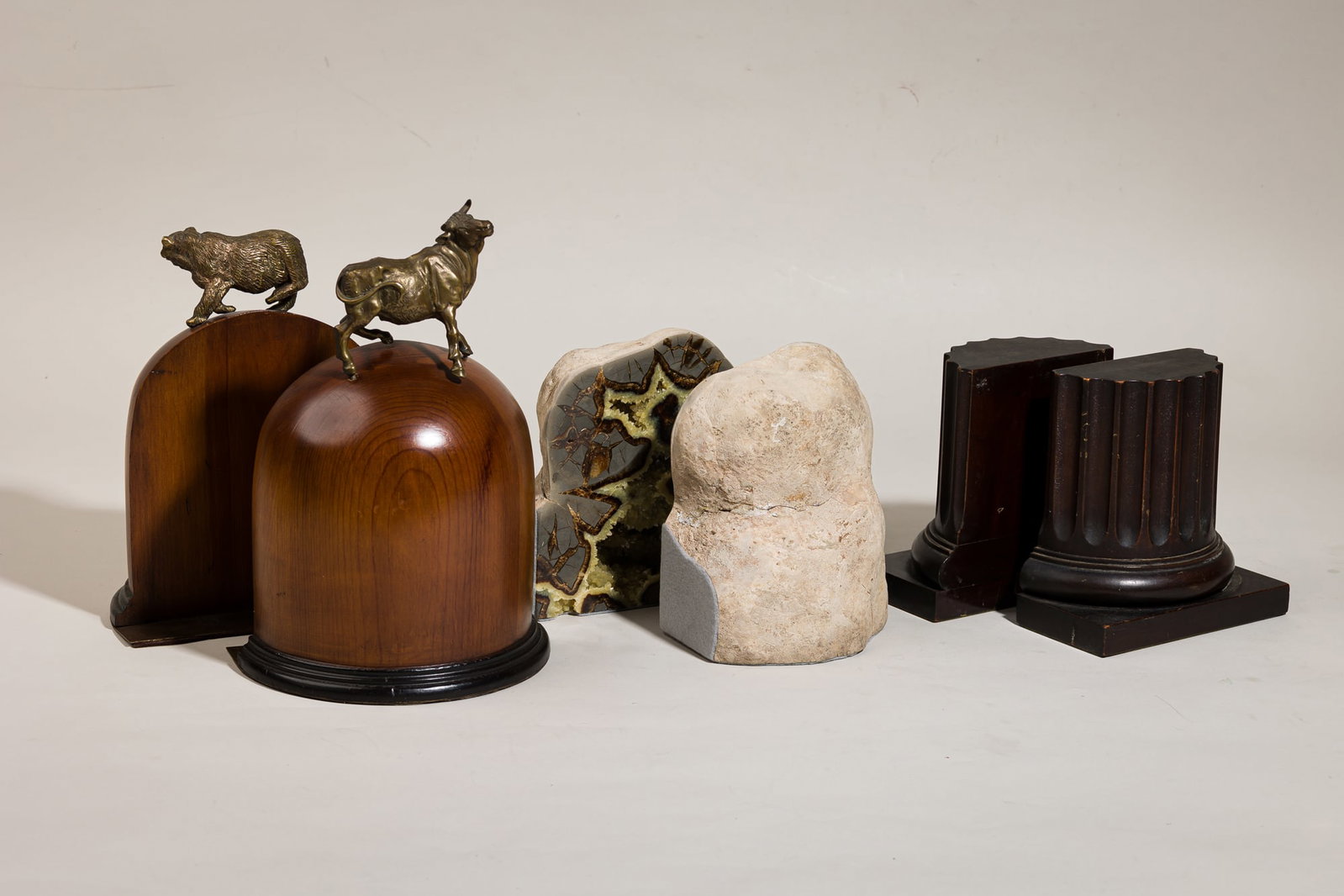 (3) Vintage sets of bookends: Including Sarreid bookends, 20th c., Spain, brass bull and bear animal figures atop a finished wooden dome, brass lined with felt on the bottom, 11.5"h x 5"w x 7.5"d; 20th c.,