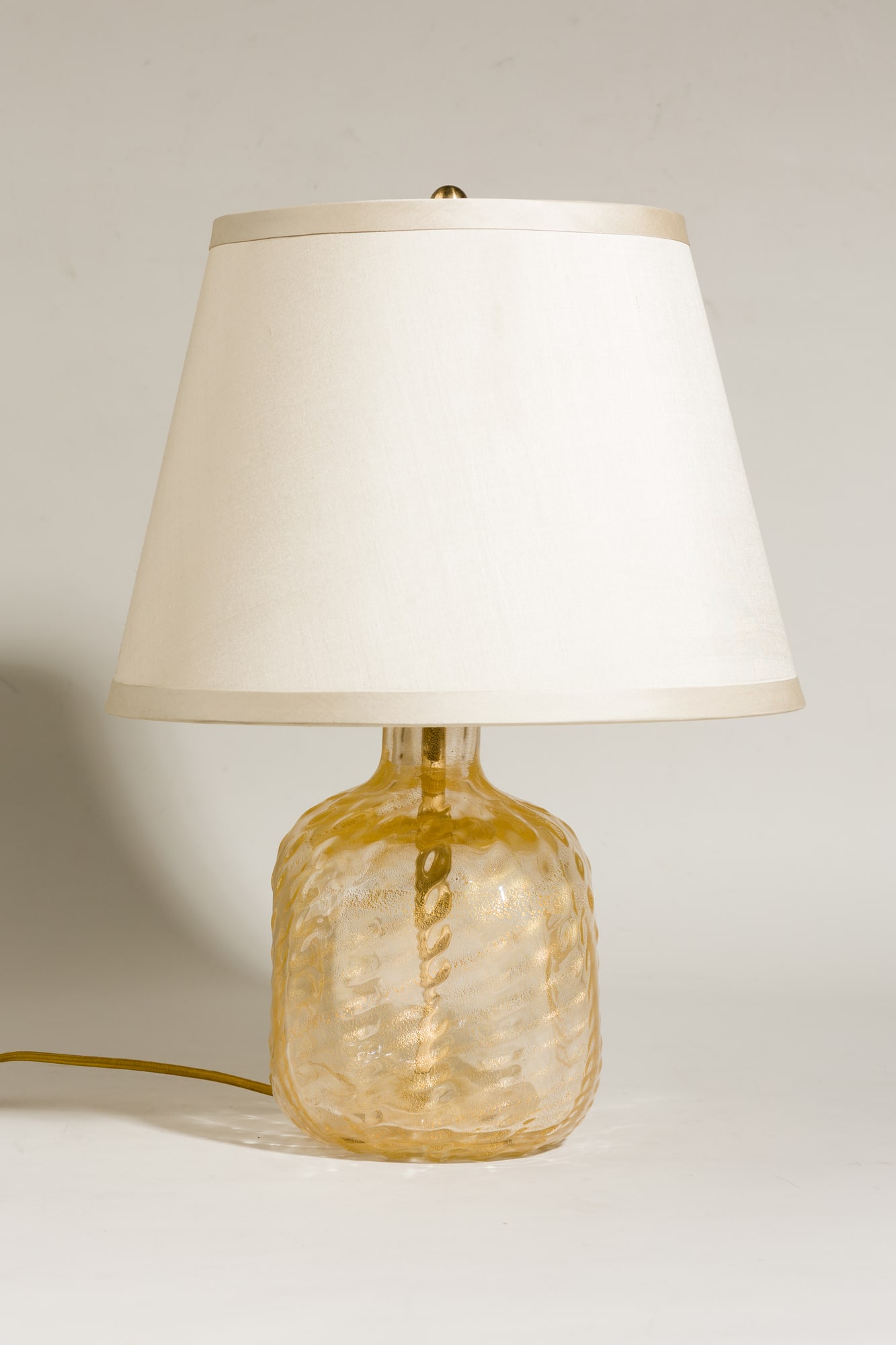 Ercole Barovier, aventurine bottle vase lamp: c. 1950s, Italy, hand-blown pinched bottle-form base with gold inclusions, wired with double-cluster socket, custom silk cone shade,19.5"h x 15.5"dia (total) Provenance: Property from 502 Pa