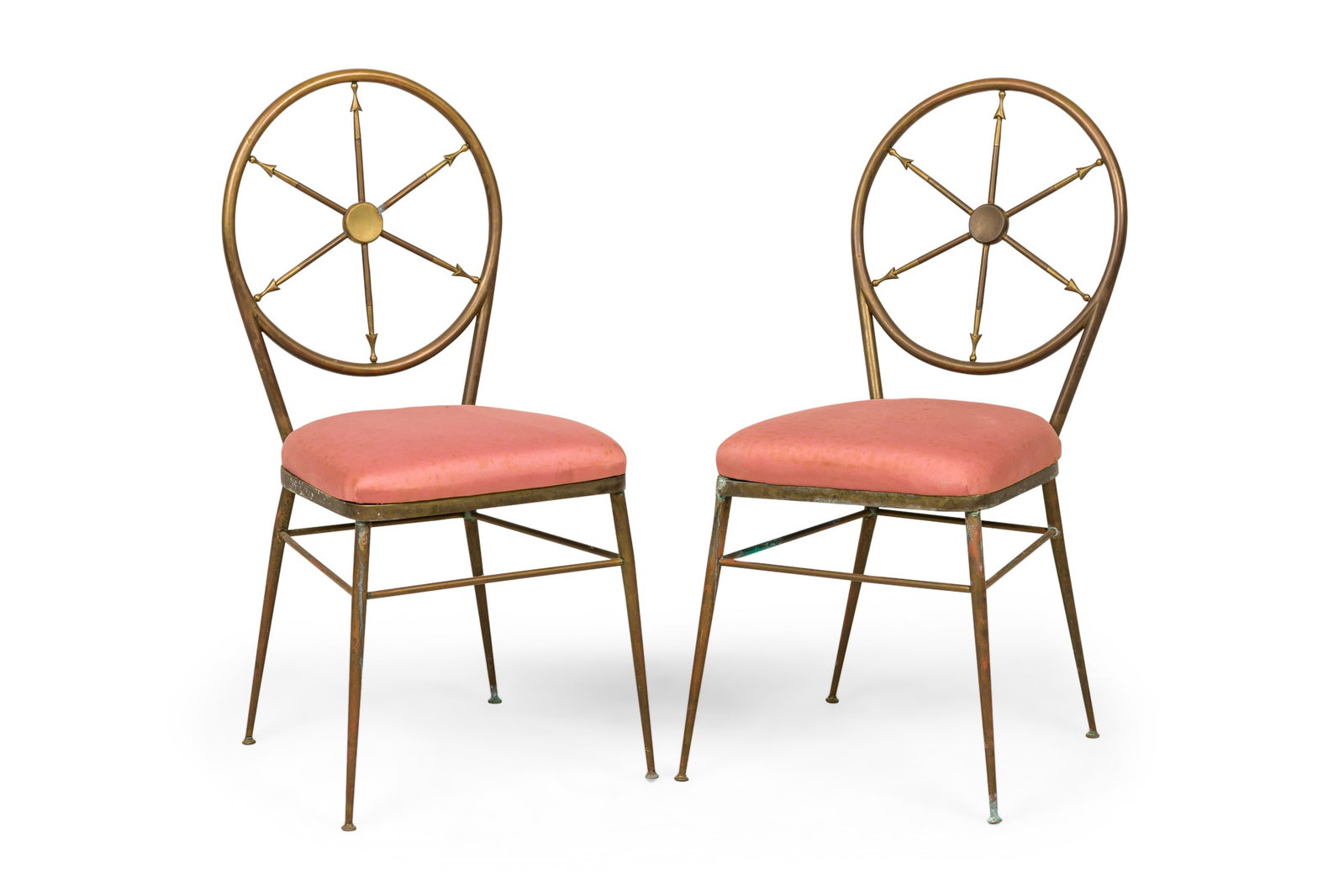 Pair American Modern brass round back wheel-spoke side chairs: c. 1954, USA, round brass frames featuring ship's wheel design backs, slip seats upholstered in rose pink fabric, resting on four tapered legs with glides, manufactured by Sherrill Furniture 