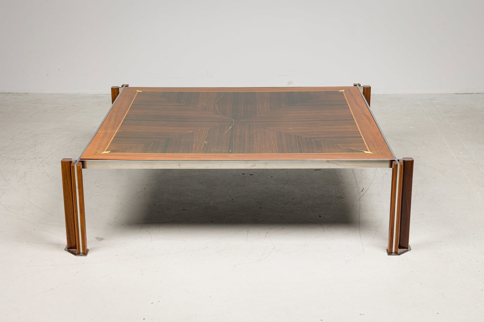 Paulo Barracchia for Roma Deco, marquetry coffee table, Mac II: c. 1980s, Italy, rectangular padouk top with a geometric maple and macassar ebony inlaid design, brass banded, double openwork wooden legs with brass feet, 17" x 60.5"l x 60.5"w Pr