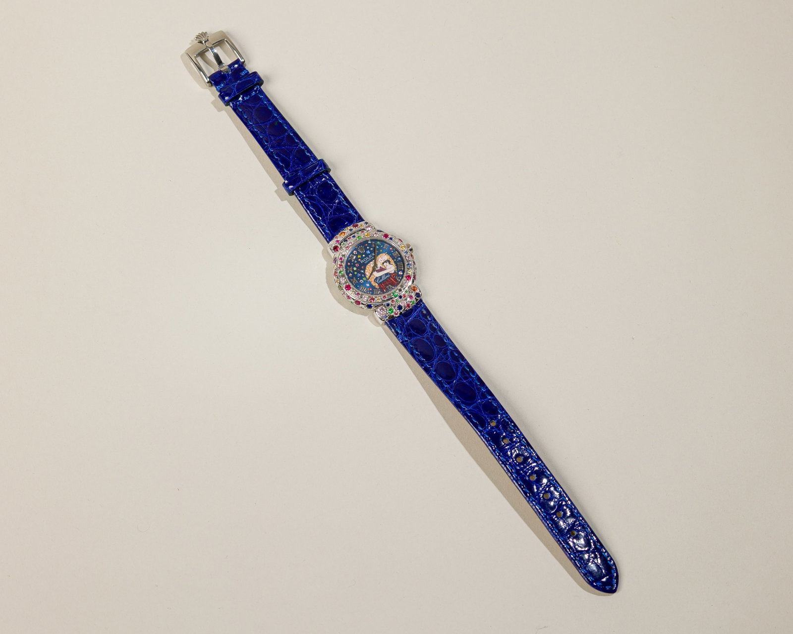 Rolex Cellini In 18K White Gold:  Circa: 1995 Dial: Original blue dial with applied Roman numerals.Hand painted detail. Case material: 18K white gold with pave colored stones Bracelet material: Blue Rolex leather strap Bracelet