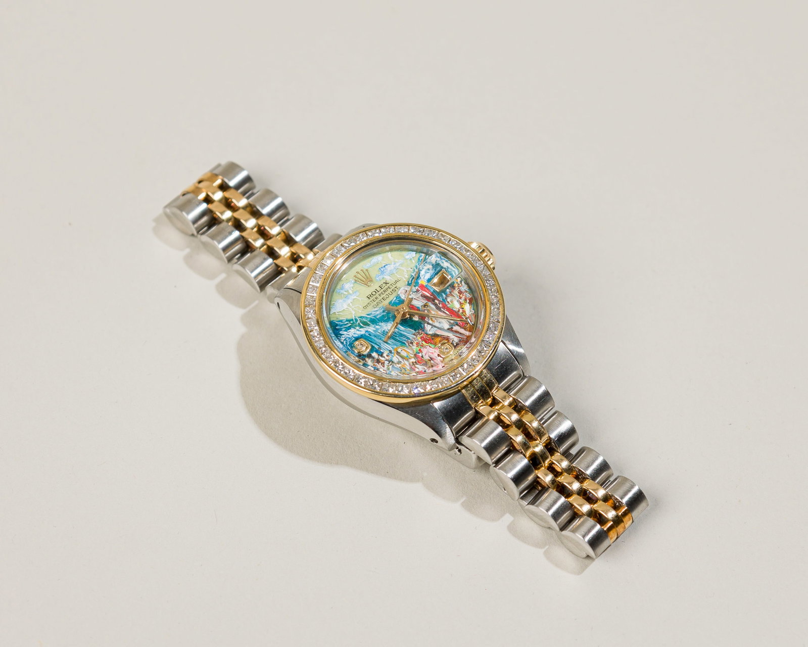 Rolex Oyster Perpetual Datejust Watch Stainless Steel/18K Yellow Gold: Circa: 1970`s Dial: Original, hand-painted Case material: Stainless steel/18K yellow gold Bracelet material: Stainless steel / 18K yellow gold Bracelet size: 7 inches Case dimensions: 26 mm in di