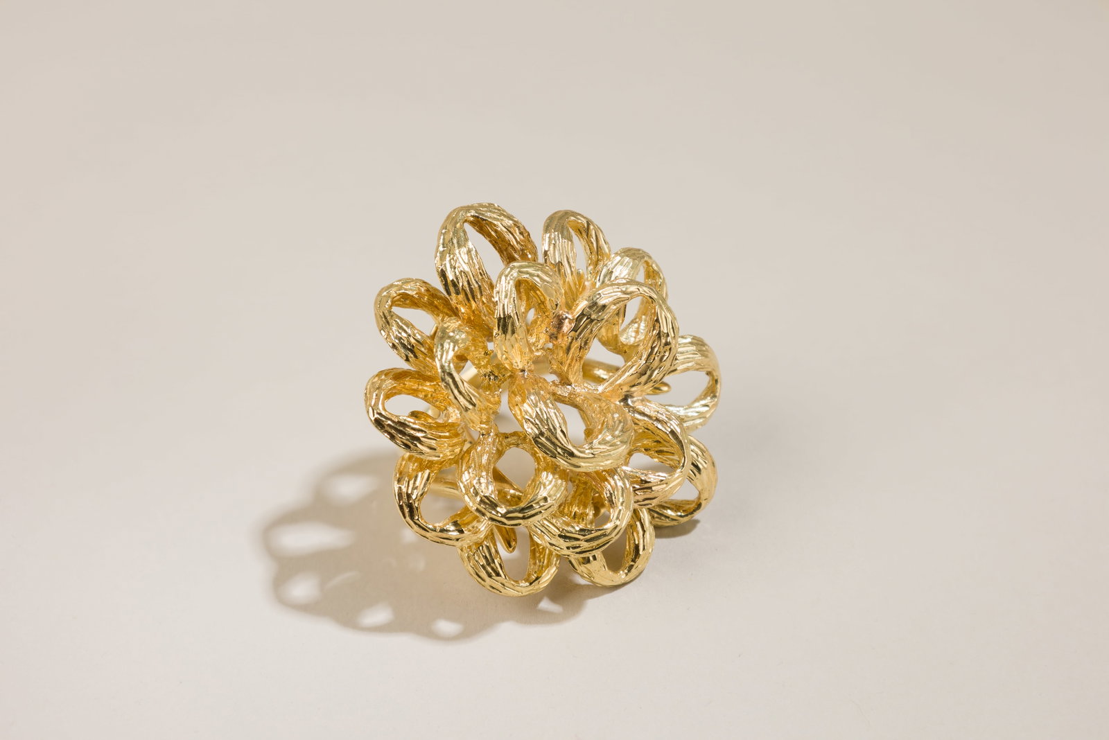 Vintage Multi-loop Ribbon Cocktail Ring: Origin: C`1970`s Metal: 18K yellow gold Measurements: 1 1/2 inches on top Ring size: 5 Weight: 34.6 g Stamped: 18K Condition: In very good conditions. Category: Cocktail Rings