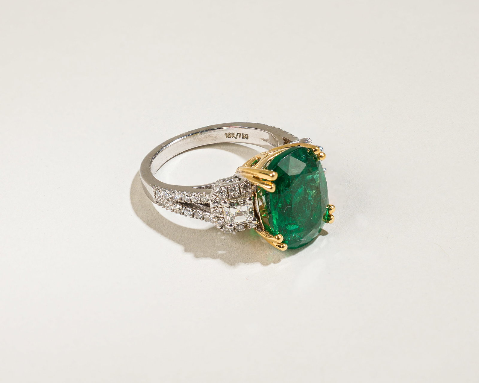 Zambian Emerald And Diamond Ring,GIA: Origin: Contemporary Metal: 18K yellow and white gold Gemstones: 6.18 carats cushion cut Zambian emerald W/GIA#7235351054; Diamond approx. 1.24 carats total, most G-H/VS Measurements: 15 mm on top Rin