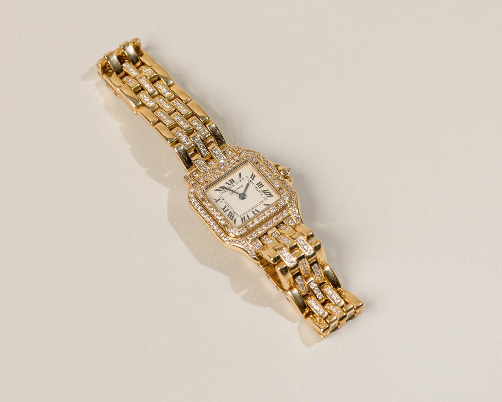 Cartier Panthere Ladies` in 18K Yellow Gold And Diamonds: Type: Cartier C`1980s Case Material: 18K yellow gold with pave set diamonds Case Dimensions: 22 mm wide x 30 mm lug-to-lug Serial Number: CC132509 Reference Number: 1070 Bracelet Material: Origin