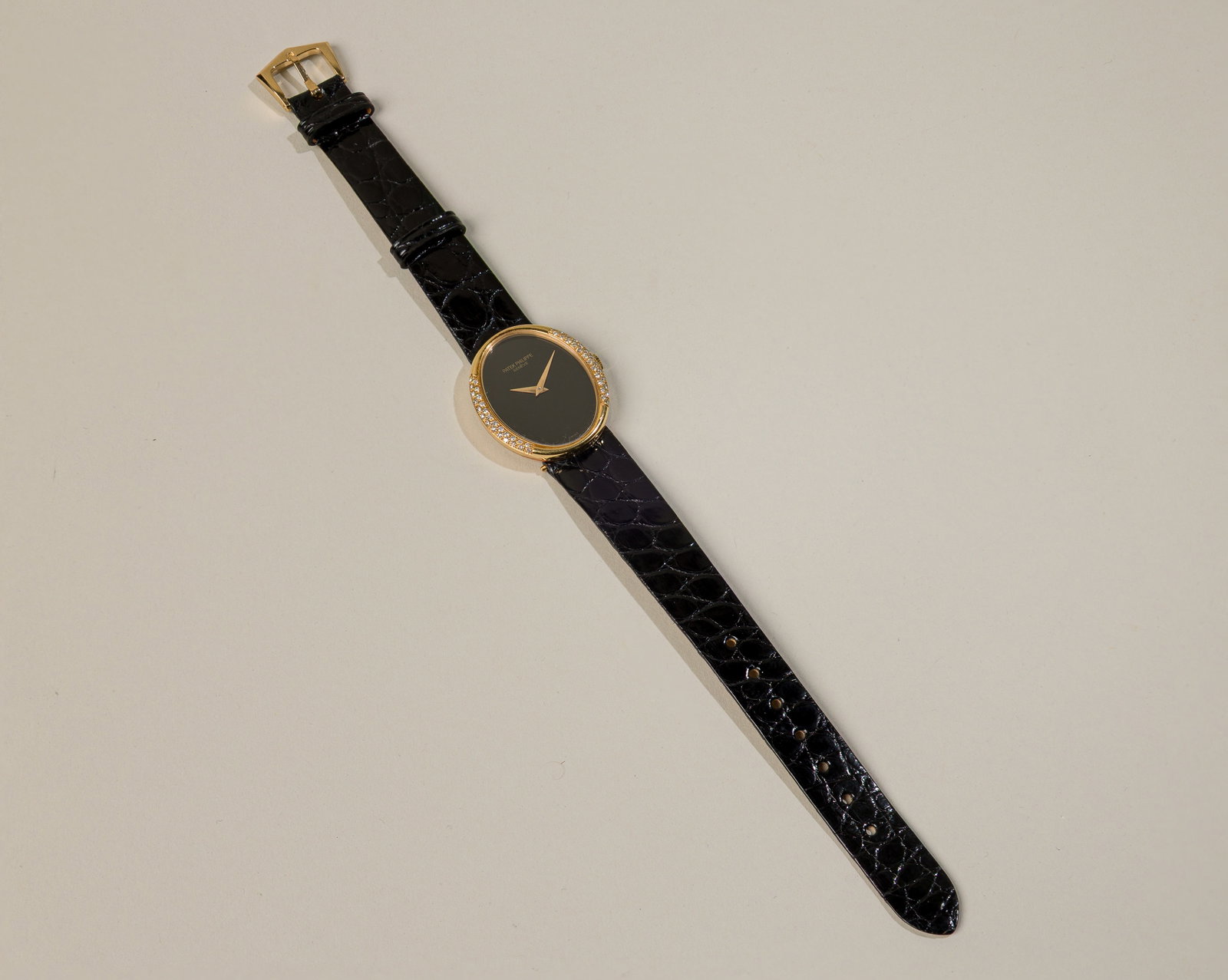 Patek Philippe Ellipse In 18K Yellow Gold With Onyx Dial: Type: Patek Philippe C`1970s Case Material: 18K yellow gold Case Dimensions: 25 mm x 29 mm oval in diameter Serial Number: 2757034 Reference Number: 4310 Bracelet Material: Black leather st