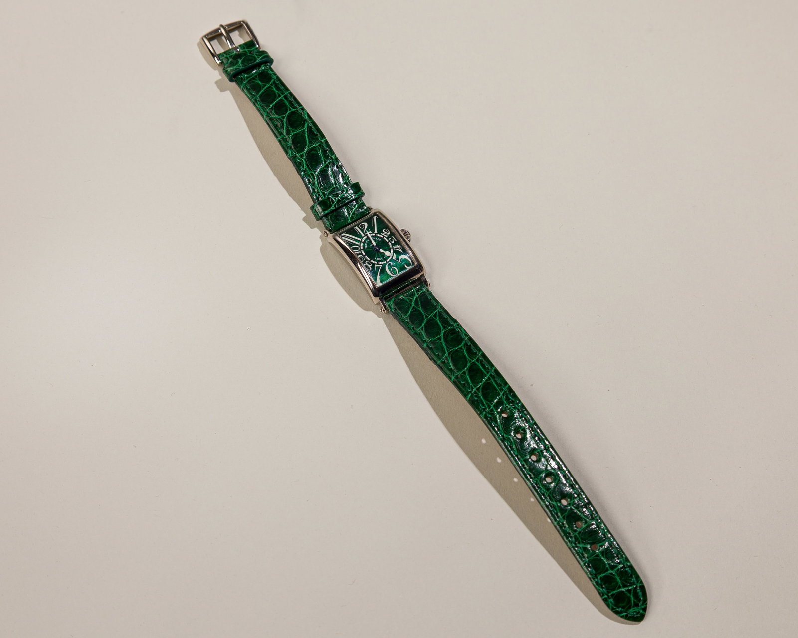 Franck Muller Long Island Ladies Watch In 18K White Gold With Green Dial: Type: Franck Muller, C`2000s Case Material: 18K white gold Case Dimensions: 18 mm wide x 32 mm lug-to-lug Dial: Green guilloche dial with white Arabic numerals Serial Number: 76 Reference Number: 802 