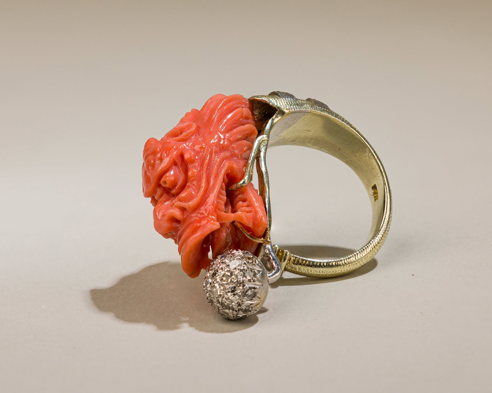 Dragon Coral And Diamond Ring: Metal:14K yellow gold Gemstones: Single cut diamonds approx. 1.00 carats total Measurements: 17 mm at widest Ring size: 8 1/2 Stamped: 14K Condition: In excellent condition Category: Rings