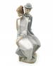 A large porcelain statue in the Spanish Lladro style, decorated with hand painting, unsigned, maker