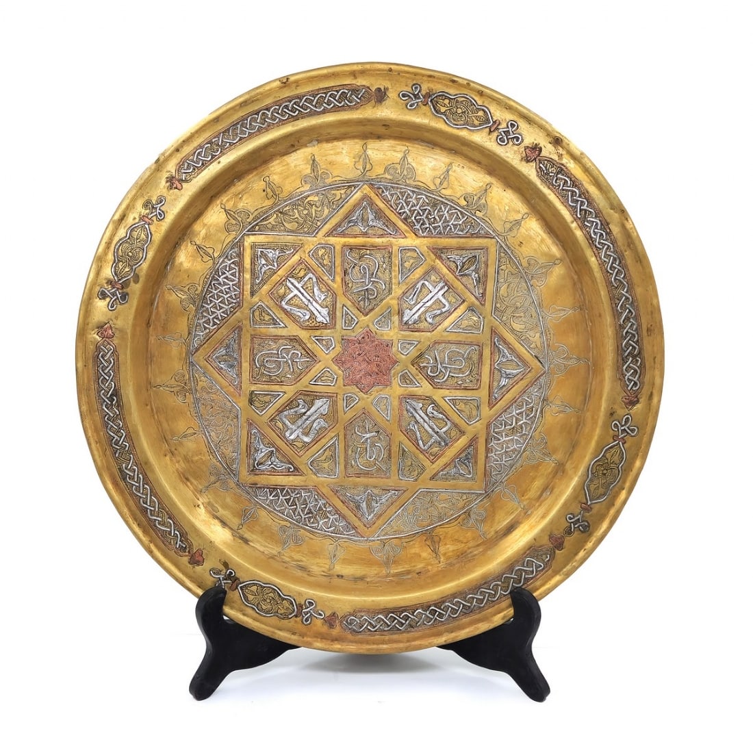 An Islamic plate made of brass, decorated with 'Damascus work' inlay (1 of 3)