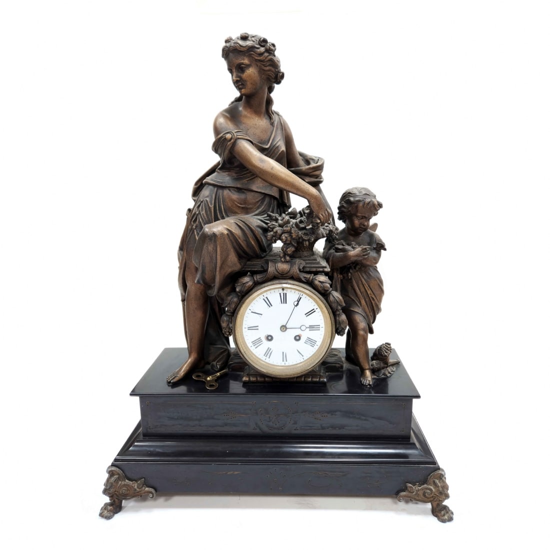 Large and Luxurious Antique French Mantel Clock, Napoleon III Period: Large and Luxurious Antique French Mantel Clock, Napoleon III Period, made of spelter and black slate, featuring a statue of Flora and Zephyr at the top, painted with cold paint for a bronze patina ap