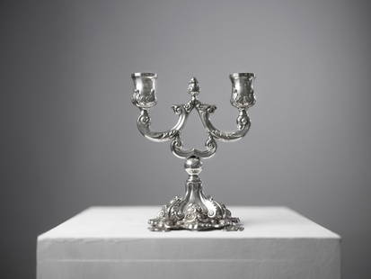 Double-armed Silver Menorah, made of sterling silver: Double-armed Silver Menorah, made of sterling silver, adorned with repousse decorations and signed. Width: 18 cm Height: 21 cm Weight: 352 gNotice: We are located in Israel and provide full packing an