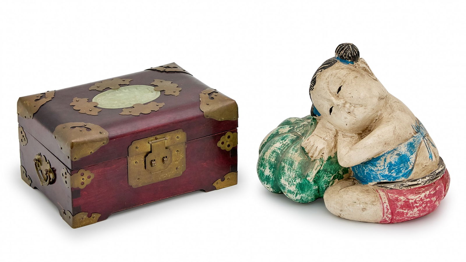 Two Asian Decorative Objects: Two Asian Decorative Objects, wooden sculpture of a child resting on a green gourd and a tabletop jewelry box made of wood, brass, and jade. The lid hinges of the box are detached. Height of sculpture