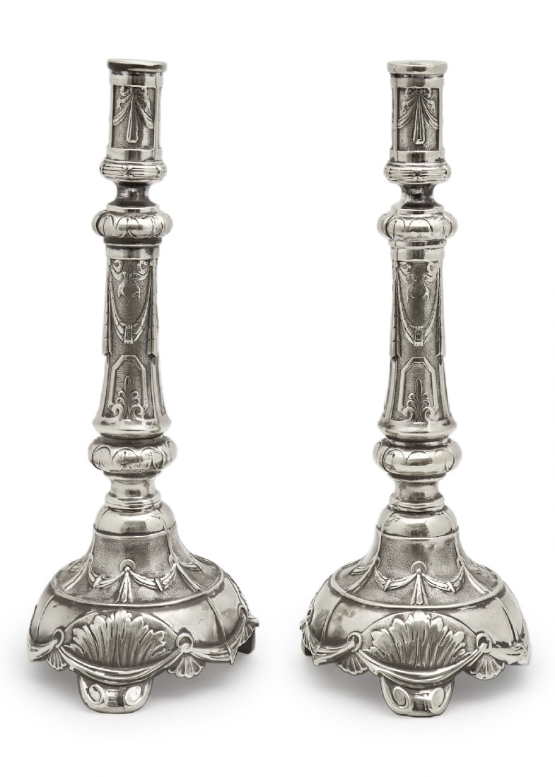 Pair of Antique Polish Jewish Candlesticks by 'Warszawa Henneberg': Pair of Antique Polish Jewish Candlesticks by 'Warszawa Henneberg', made of brass and stamped with a Star of David used by the manufacturer Between 1870 - 1874 Height: 38 cm Base diameter: 17 cmNotice