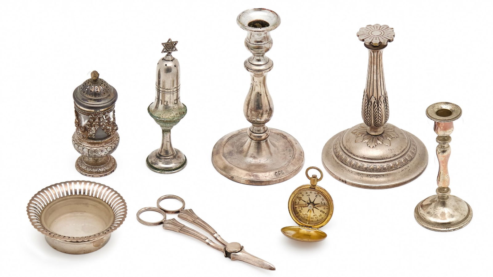 Lot of Eight Various Items Made of Metal, Mostly Silver-Plated: Lot of Eight Various Items Made of Metal, Mostly Silver-Plated, the lot includes: two different candlesticks, centerpiece stand, two spice containers for Havdalah Decoration in the shape of a compass,