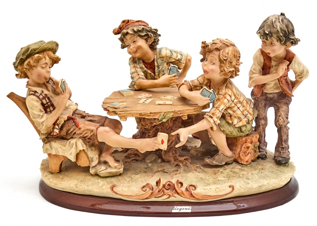 Italian Handcrafted Porcelain Statue in Capodimonte Style: Italian Handcrafted Porcelain Statue in Capodimonte Style, depicts four boys around a card game table Not signed Width: 41 cm Height: 24 cmNotice: We are located in Israel and provide full packing and