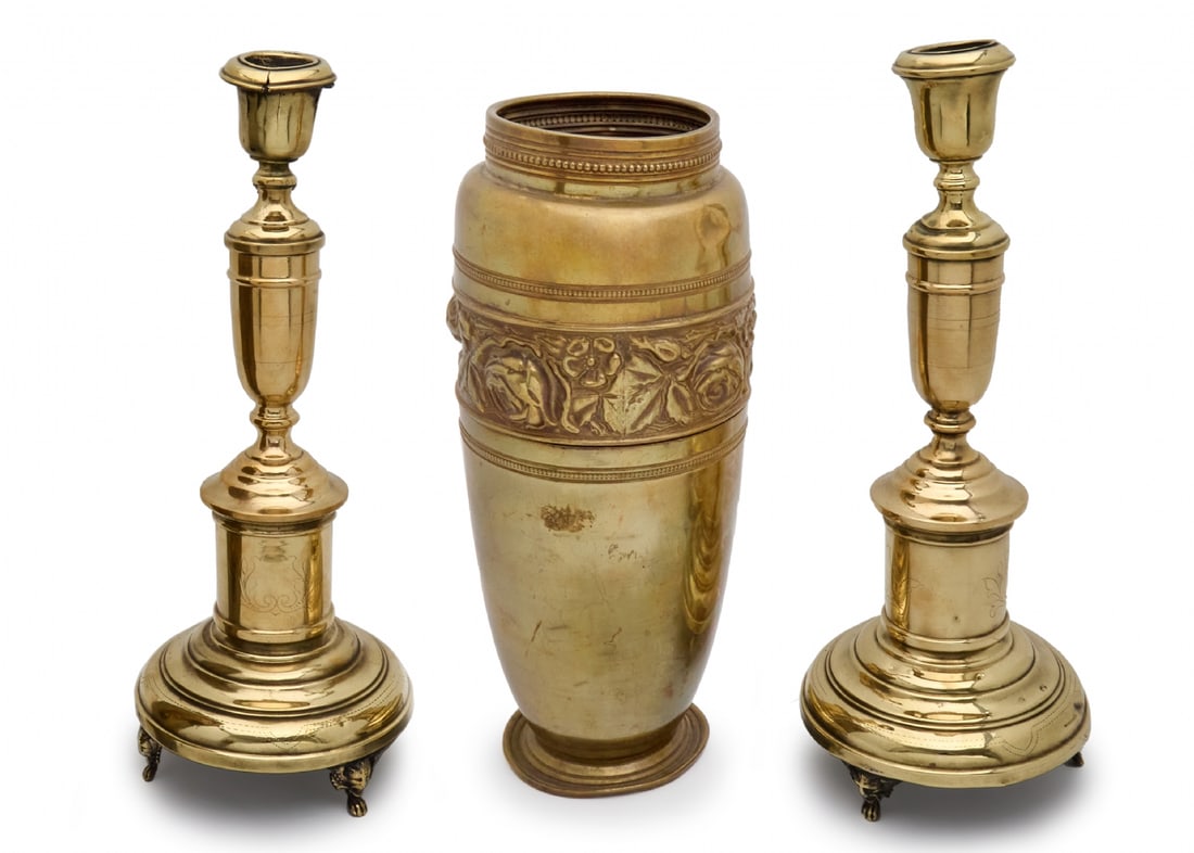 A pair of candlesticks and a vase made of copper and brass: A pair of candlesticks and a vase made of copper and brass, wear, dents to the vase, one candlestick foot repaired Heights respectively: 35â€“38 cm Notice: We are located in Israel and provid